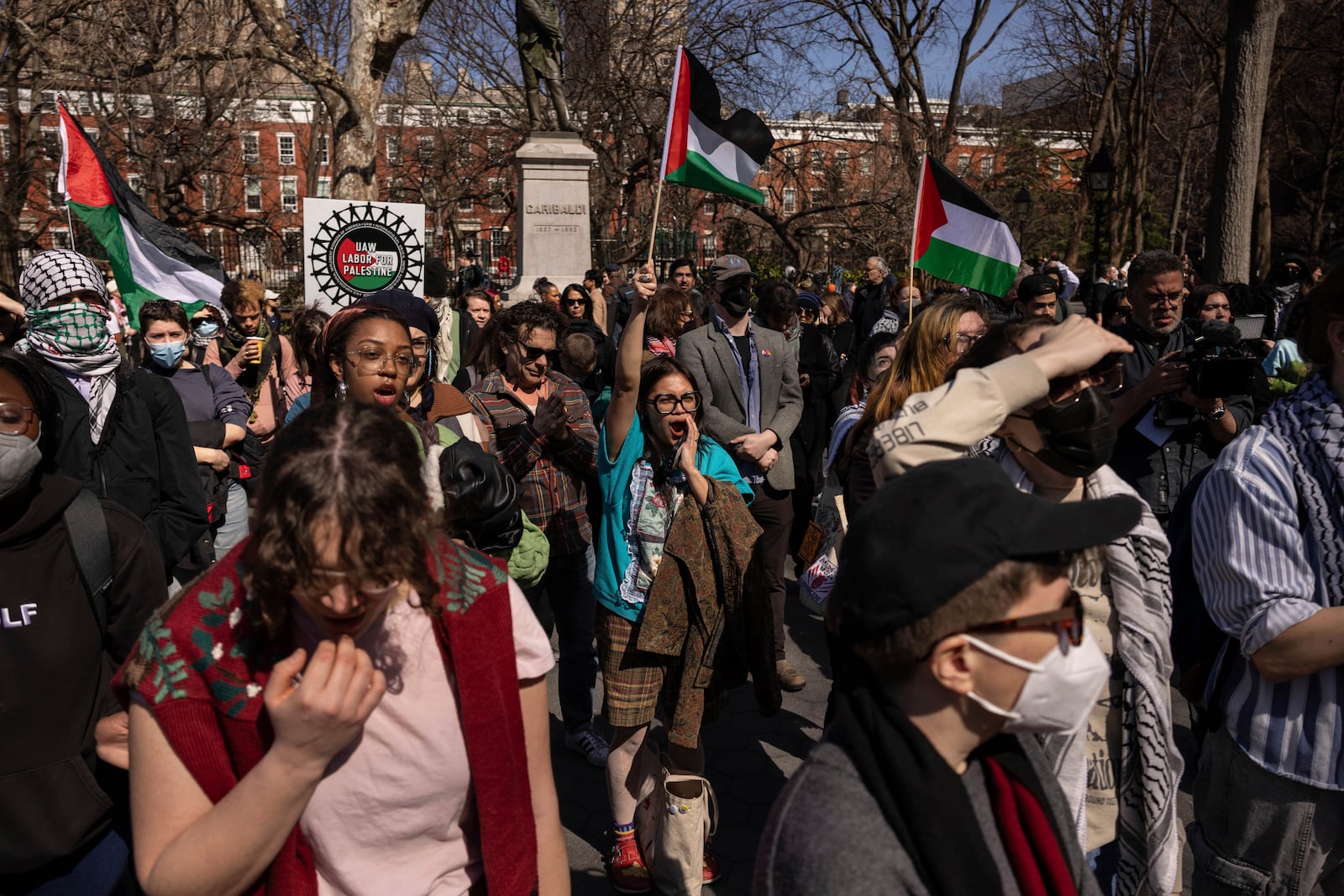 A protester including students of New York University gather for a demonstration in support of Palestinian activist Mahmoud Khalil at Washington Square Park, Tuesday, March 11, 2025, in New York. (AP Photo/Yuki Iwamura)