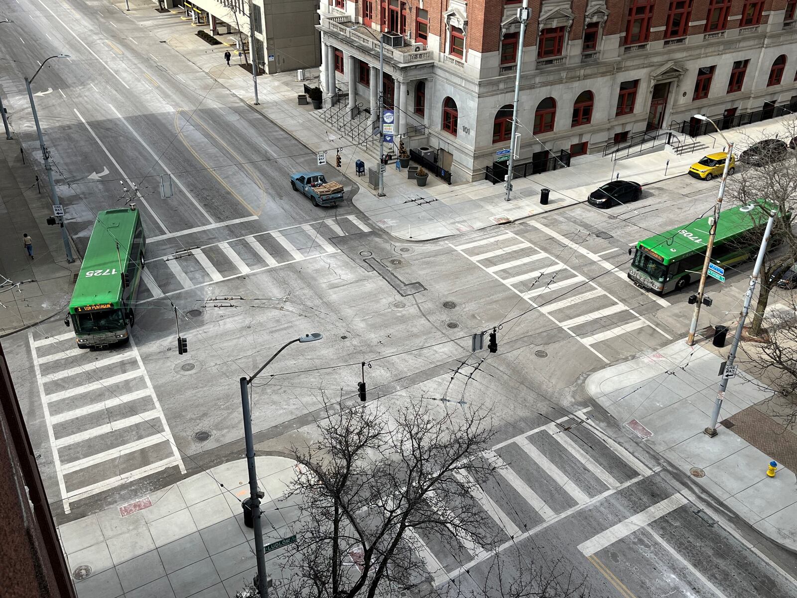 Two Greater Dayton RTA buses at West Third and Ludlow streets. CORNELIUS FROLIK / STAFF