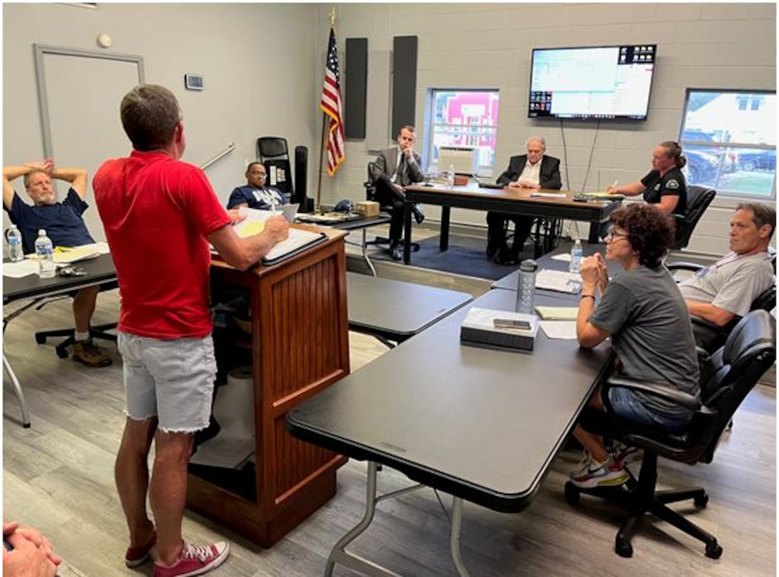 Harveysburg Village Council hears a report during its meeting on Monday, Sept. 11, 2023. At that meeting, council adopted a new building permit fee schedule that goes into effect on Oct. 11, 2023.  ED RICHTER/STAFF