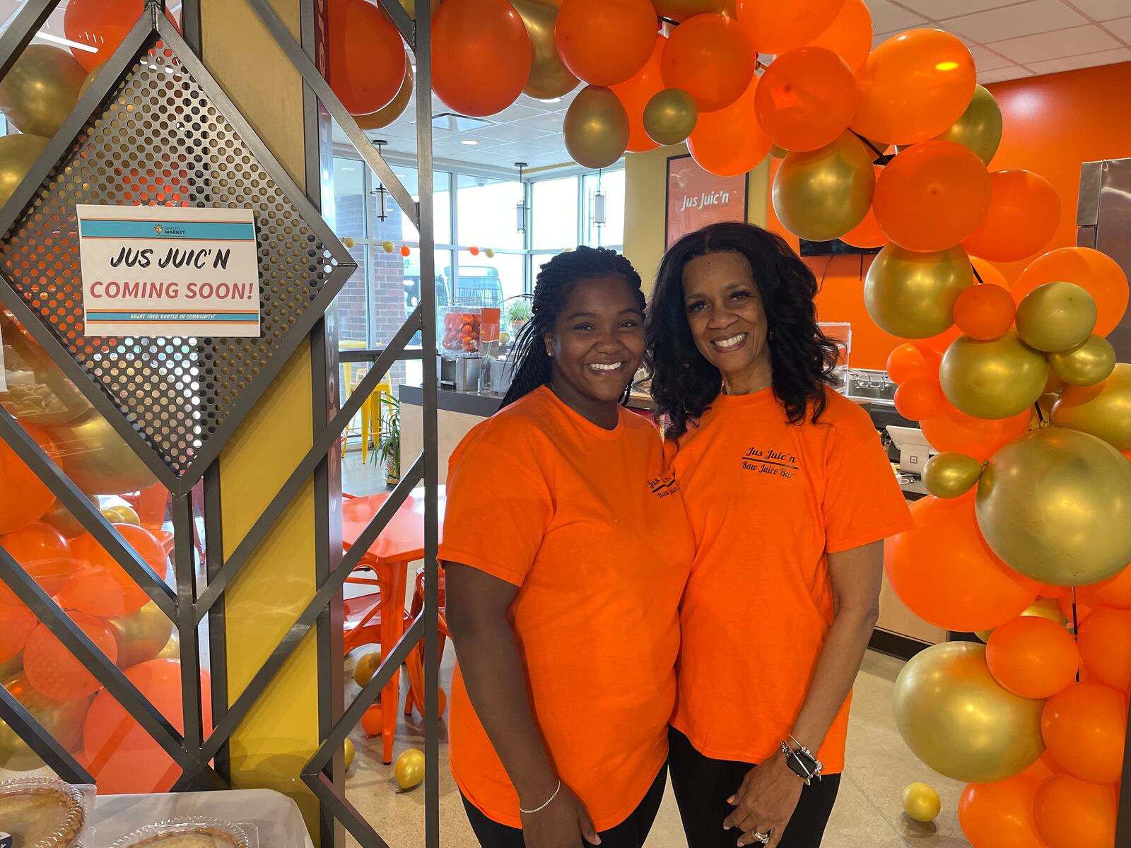 Jus Juic’n is holding a grand opening for its third location in the Dayton region inside Gem City Market at noon on Saturday, April 13. Pictured is General Manager T’Aira Scott and her mom, Shari Mann, the president of Jus Juic’n. NATALIE JONES/STAFF