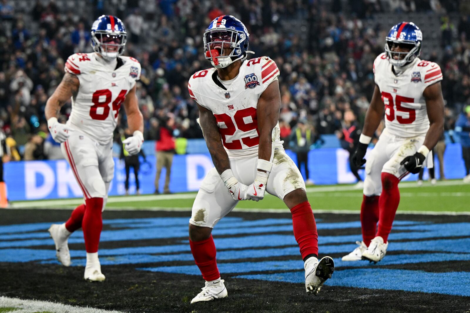 New York Giants running back Tyrone Tracy Jr. celebrates after scoring against the Carolina Panthers during the second half of an NFL football game, Sunday, Nov. 10, 2024, in Munich, Germany. (AP Photo/Lennart Preiss)