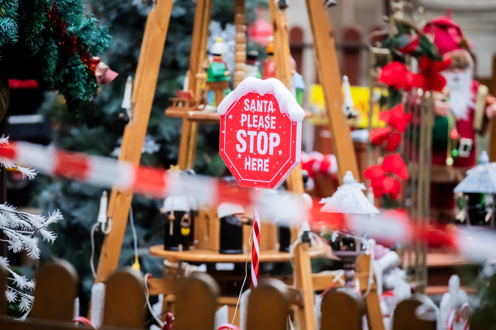 "Santa please stop here" is written on a sign behind a police cordon at the Christmas market in Magdeburg, Germany, Saturday, Dec. 21, 2024. (Christoph Soeder/dpa via AP)