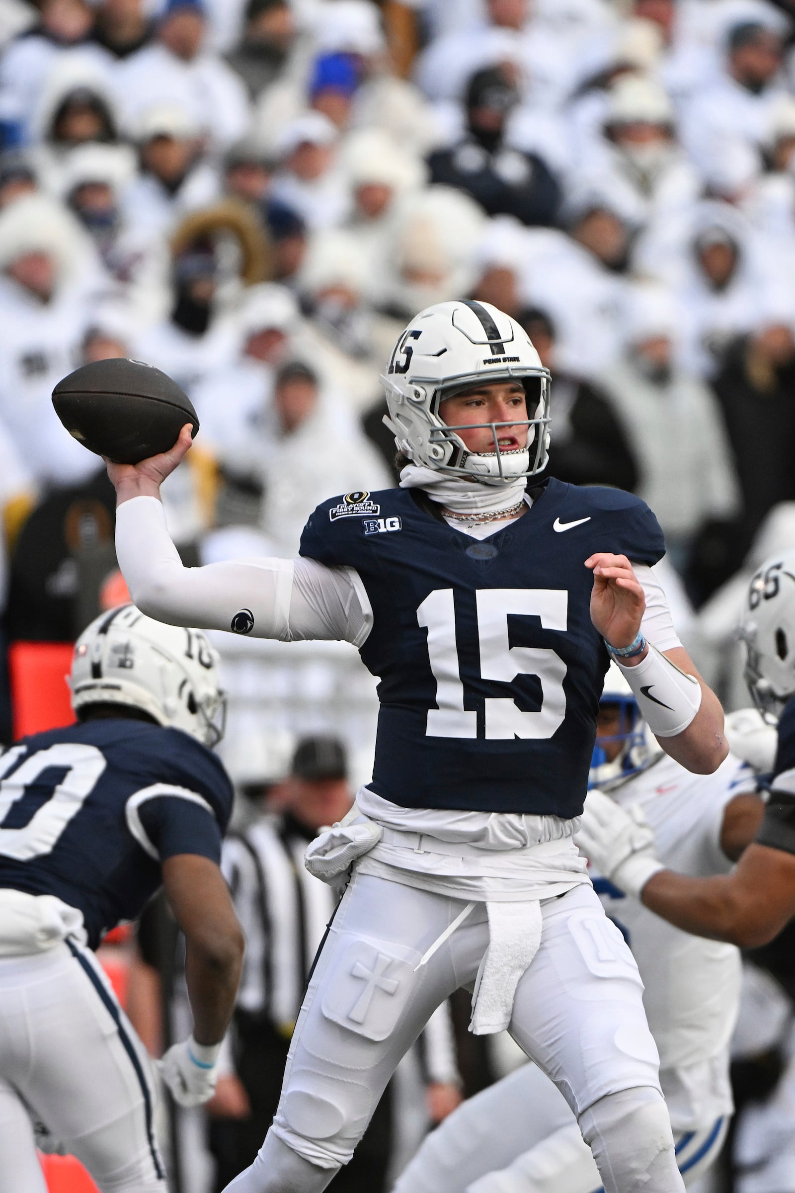 Penn State quarterback Drew Allar (15) throws a pass against SMU during the first half in the first round of the College Football Playoff, Saturday, Dec. 21, 2024, in State College, Pa. (AP Photo/Barry Reeger)