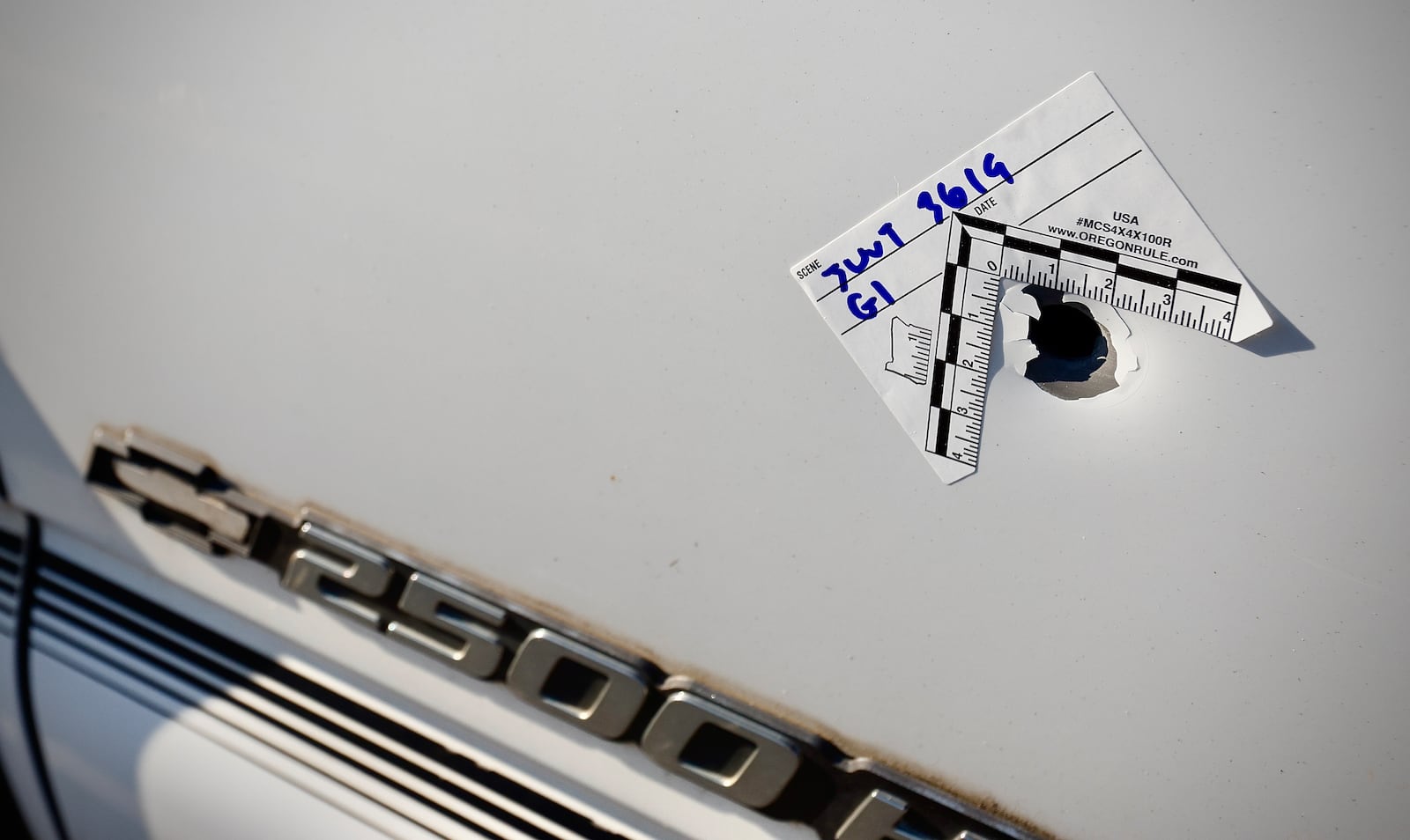 Several vehicles have bullet holes along Home Avenue in Dayton after an early morning shooting Monday, June 24, 2024. MARSHALL GORBY \STAFF