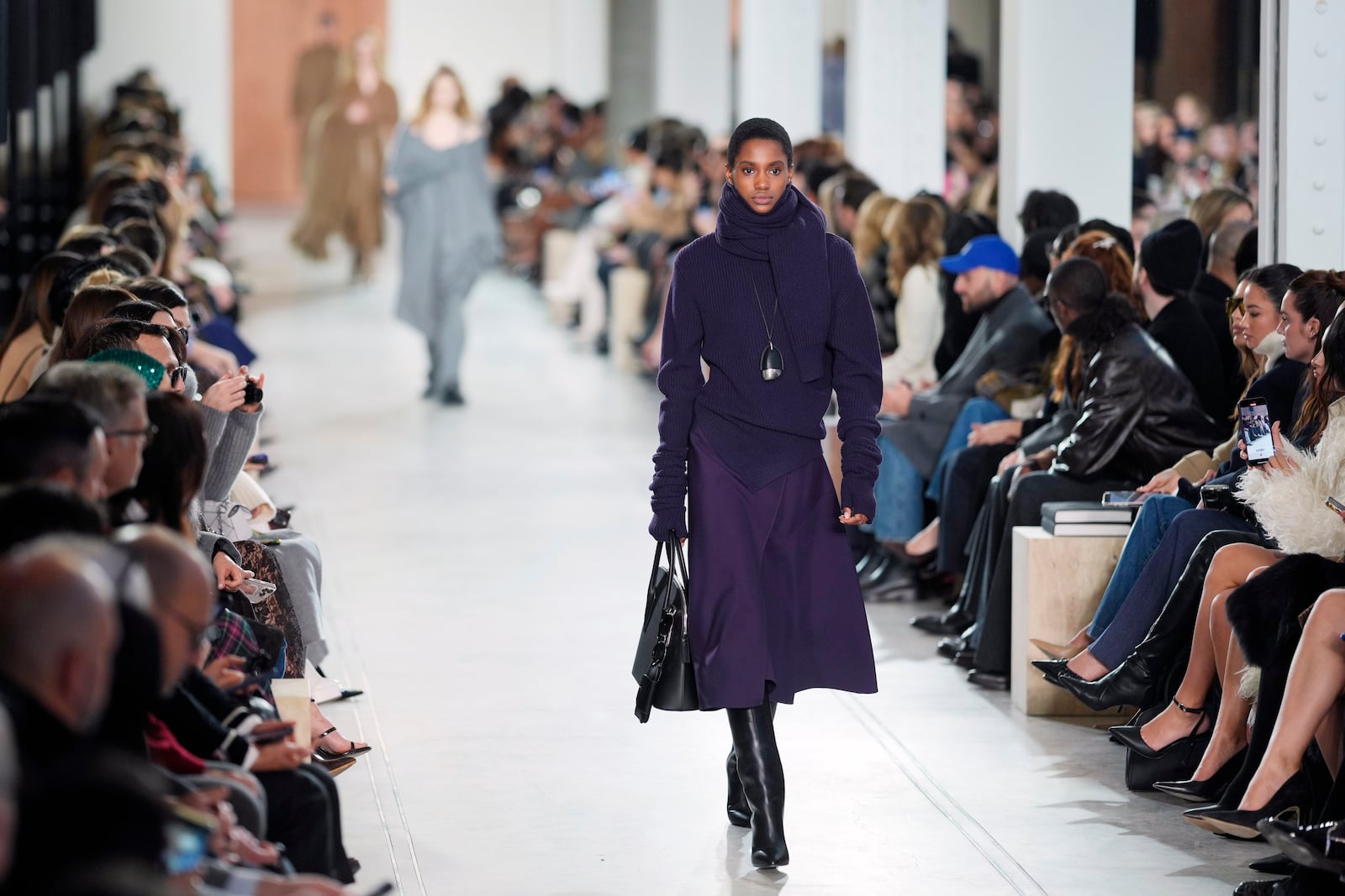 A model walks the runway during the Michael Kors Fall/Winter 2025 fashion show as part of New York Fashion Week on Tuesday, Feb. 11, 2025, at Terminal Warehouse in New York. (Photo by Charles Sykes/Invision/AP)