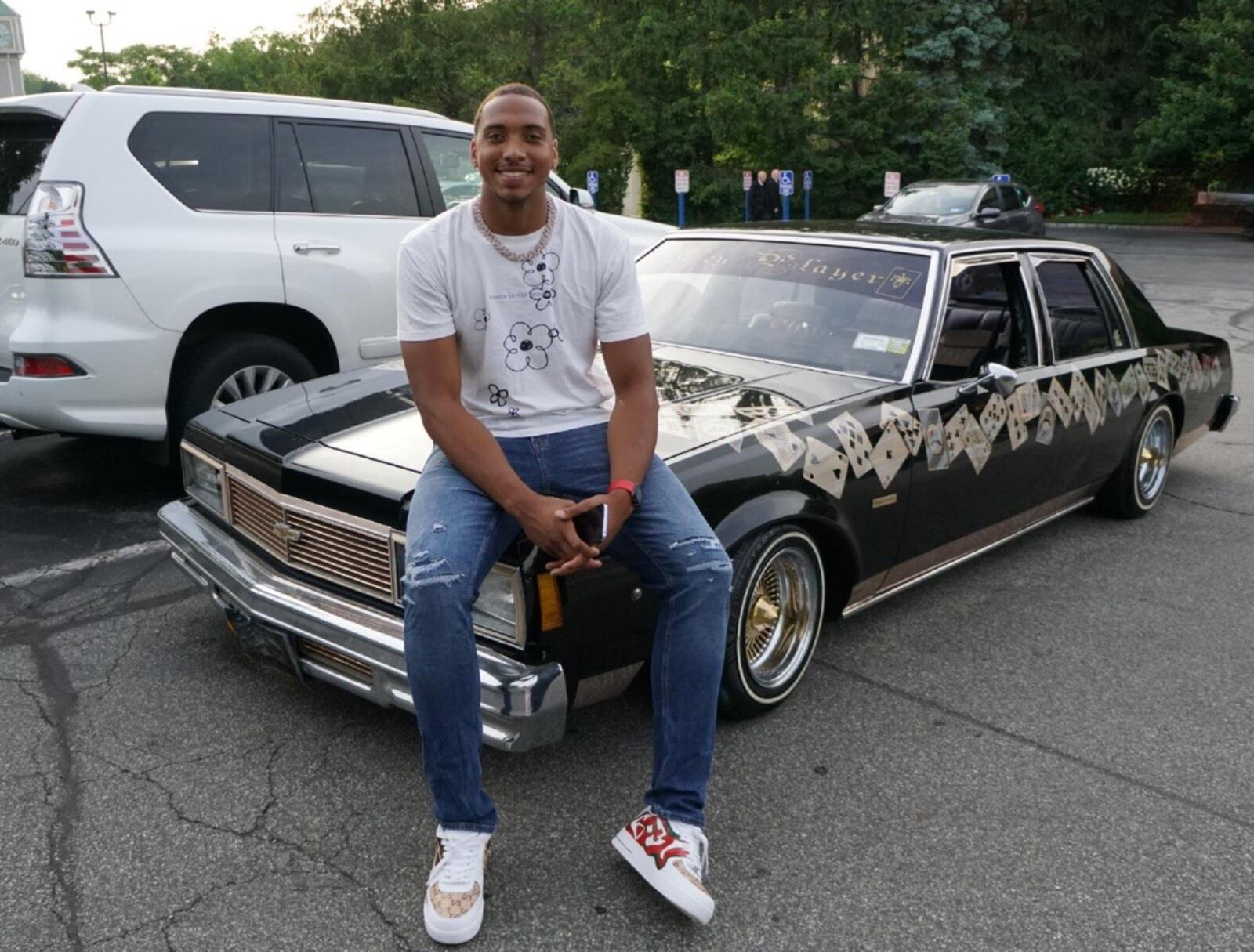 ZED Key, who was then 20, sits on the hood of his dad’s lowrider, a 1979 Chevy Impala with its customized paint job. His dad has owned the car – dubbed the Key Player – 27 years and often displayed it at car shows. CONTRIBUTED