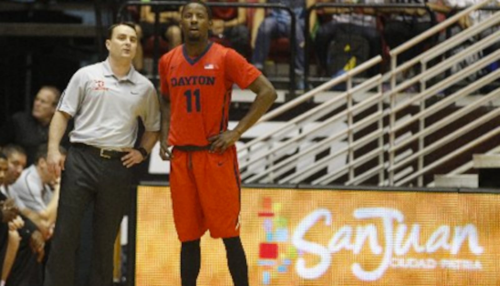 Dayton coach Archie Miller and guard Scoochie Smith talk during a game against Boston College at the Puerto Rico Tip-Off on Sunday, Nov. 23, 2014, in San Juan, P.R. David Jablonski/Staff