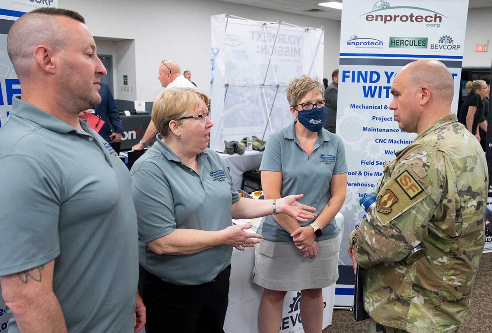 Senior Master Sgt. Joshua Stephenson, 88th Security Forces Squadron, listens to a team from Enprotech tell him about career opportunities during the Hiring Our Heroes event June 22 at Hope Hotel near Wright-Patterson Air Force Base. U.S. AIR FORCE PHOTO/R.J. ORIEZ