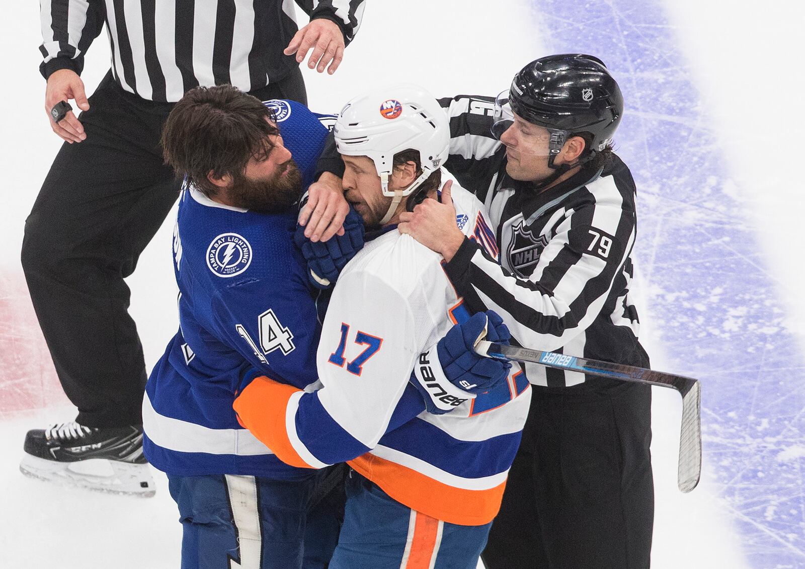 Tampa Bay Lightning's Pat Maroon (14) and New York Islanders' Matt Martin (17) rough it up during the second period of Game 2 of the NHL hockey Eastern Conference final, Wednesday, Sept. 9, 2020, in Edmonton, Alberta. (Jason Franson/The Canadian Press via AP)