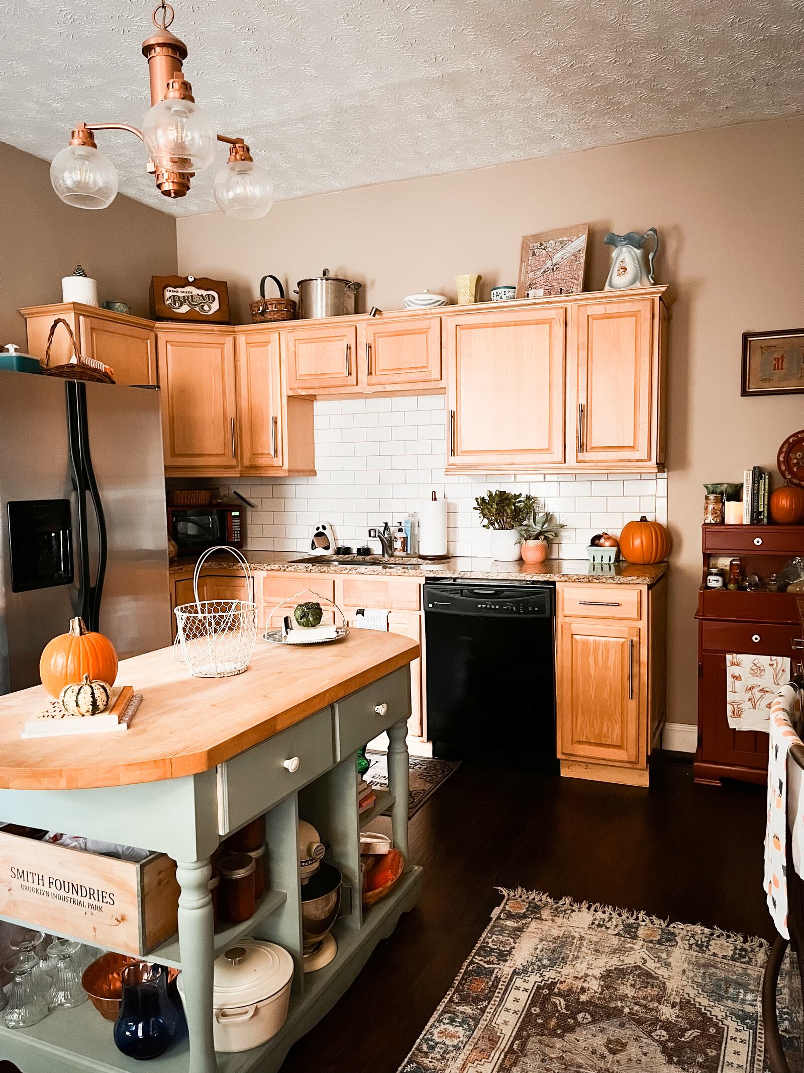 The couple's kitchen reflects creativity and joy. 