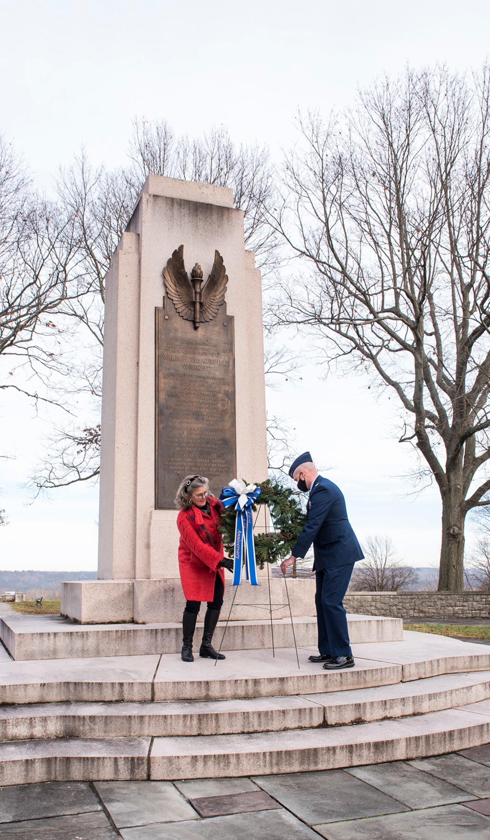 Amanda Wright Lane, great-grandniece of Wilbur and Orville Wright, and Col. Ivan Herwick, 88th Communications Group commander, lay a wreath at the Wright Brothers Memorial during the 118th First Flight anniversary Dec. 17. The annual ceremony commemorated the Wright brothers and their contributions to manned powered flight. U.S. AIR FORCE PHOTO/JAIMA FOGG