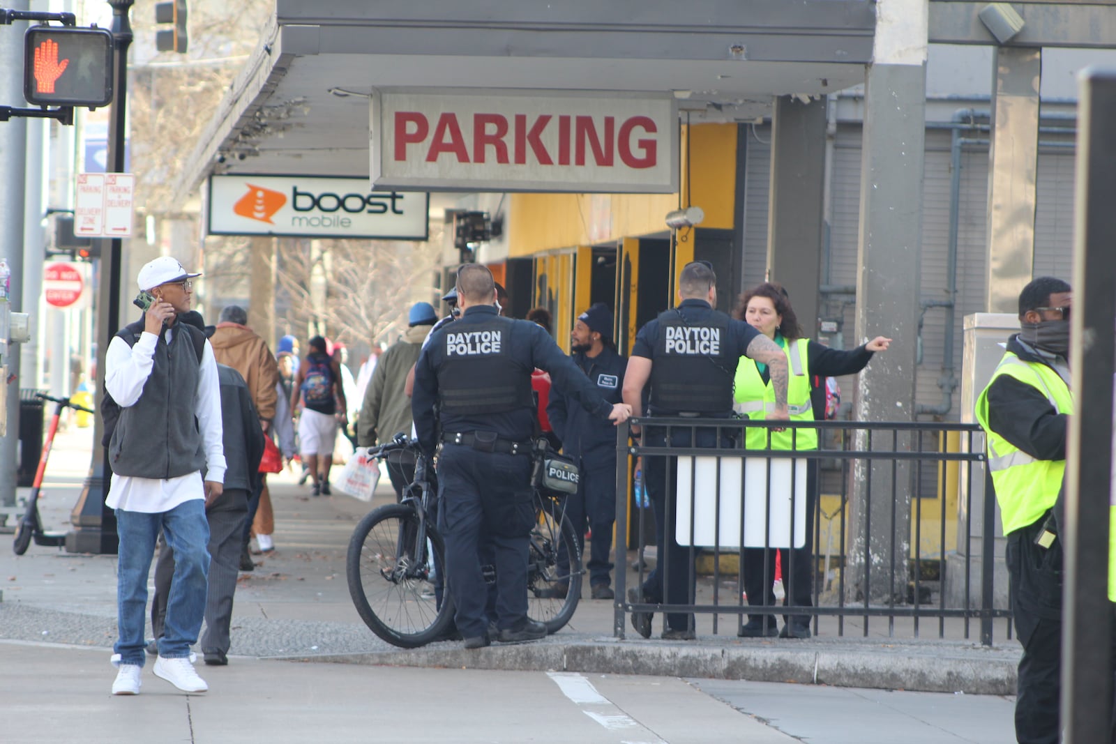 Half a dozen Dayton police officers, including a few on bicycles, watch over the area by Wright Stop Plaza, the downtown transit center. CORNELIUS FROLIK / STAFF