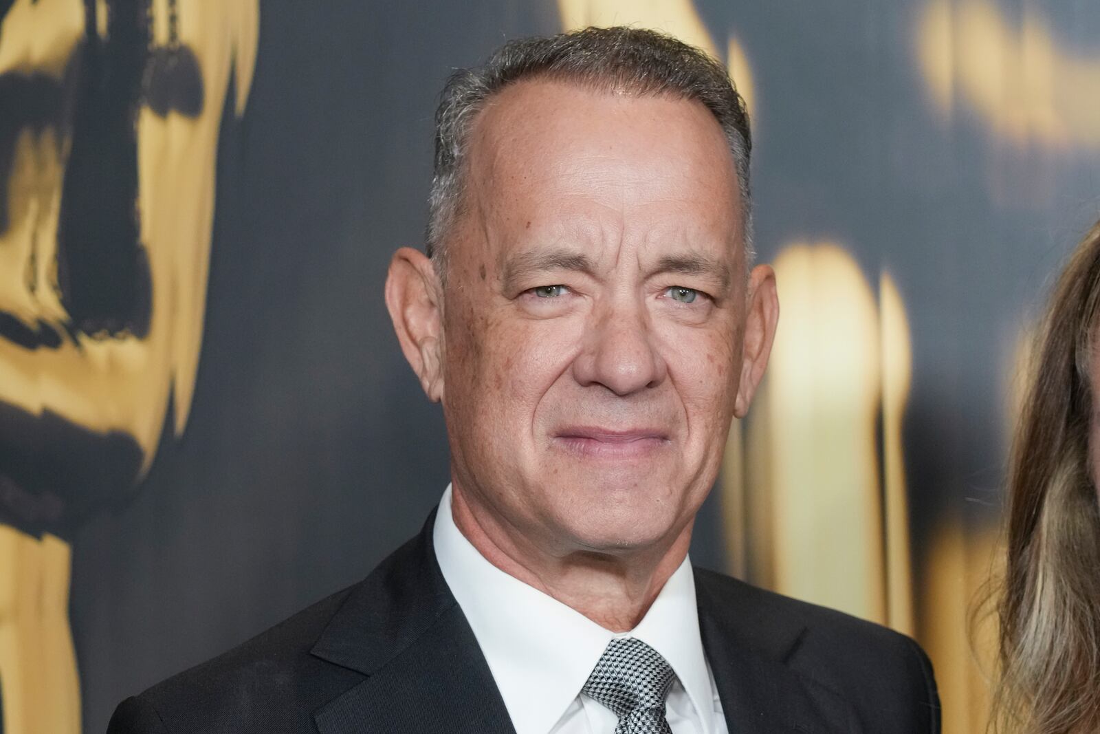 FILE - Tom Hanks arrives at the 15th Governors Awards, Nov. 17, 2024, at The Ray Dolby Ballroom in Los Angeles. (Photo by Jordan Strauss/Invision/AP, File)