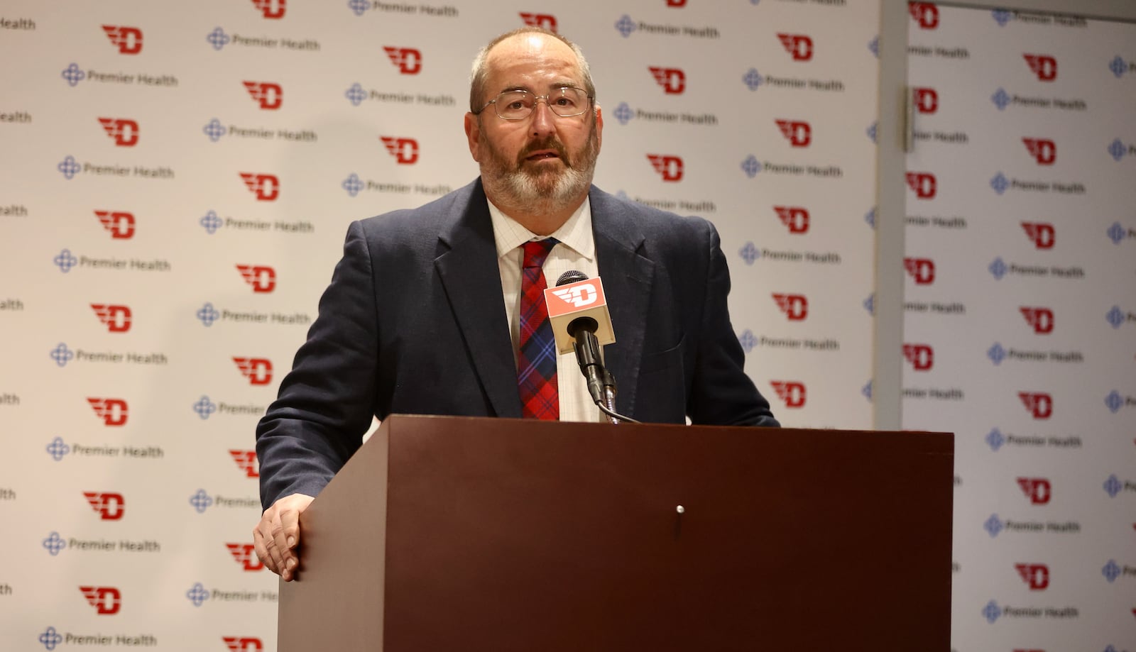 Dayton's Doug Hauschild speaks at a press conference announcing football coach Rick Chamberlin's retirement on Wednesday, Nov. 30, 2022, at UD Arena. David Jablonski/Staff