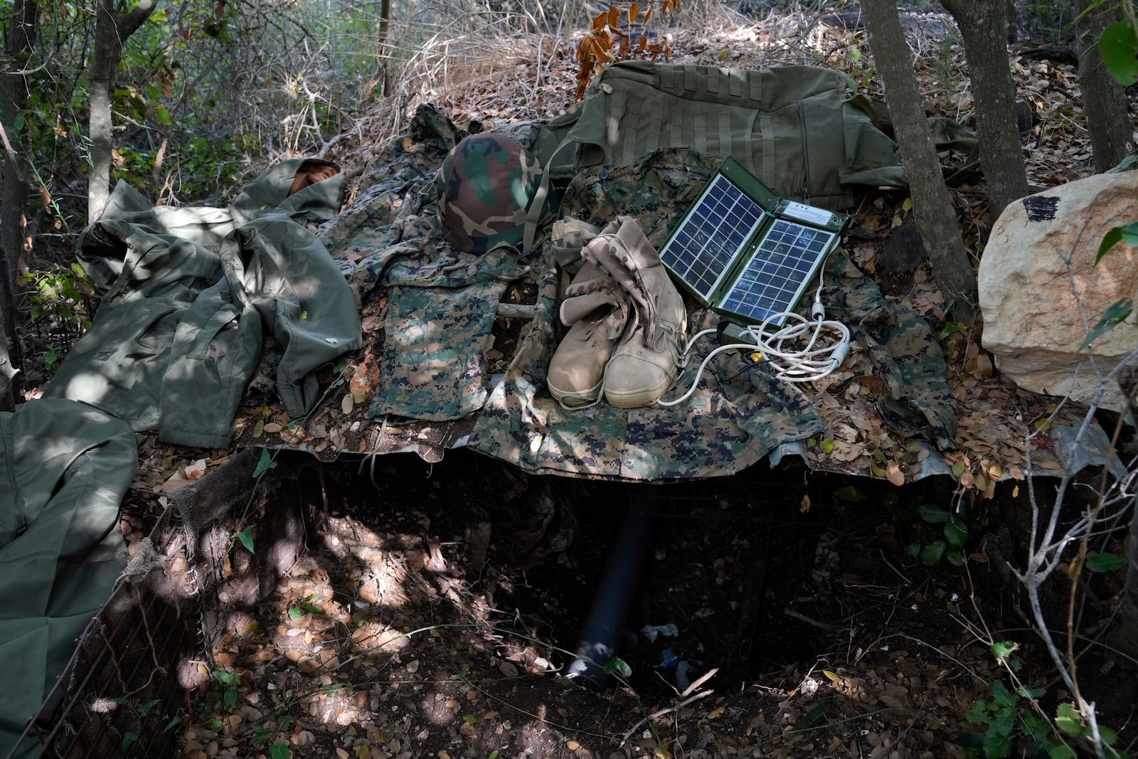 Israeli soldiers display to the media what they say is Hezbollah gear found during their ground operation in southern Lebanon, near the border with Israel, Sunday, Oct. 13, 2024. (AP Photo/Sam McNeil)