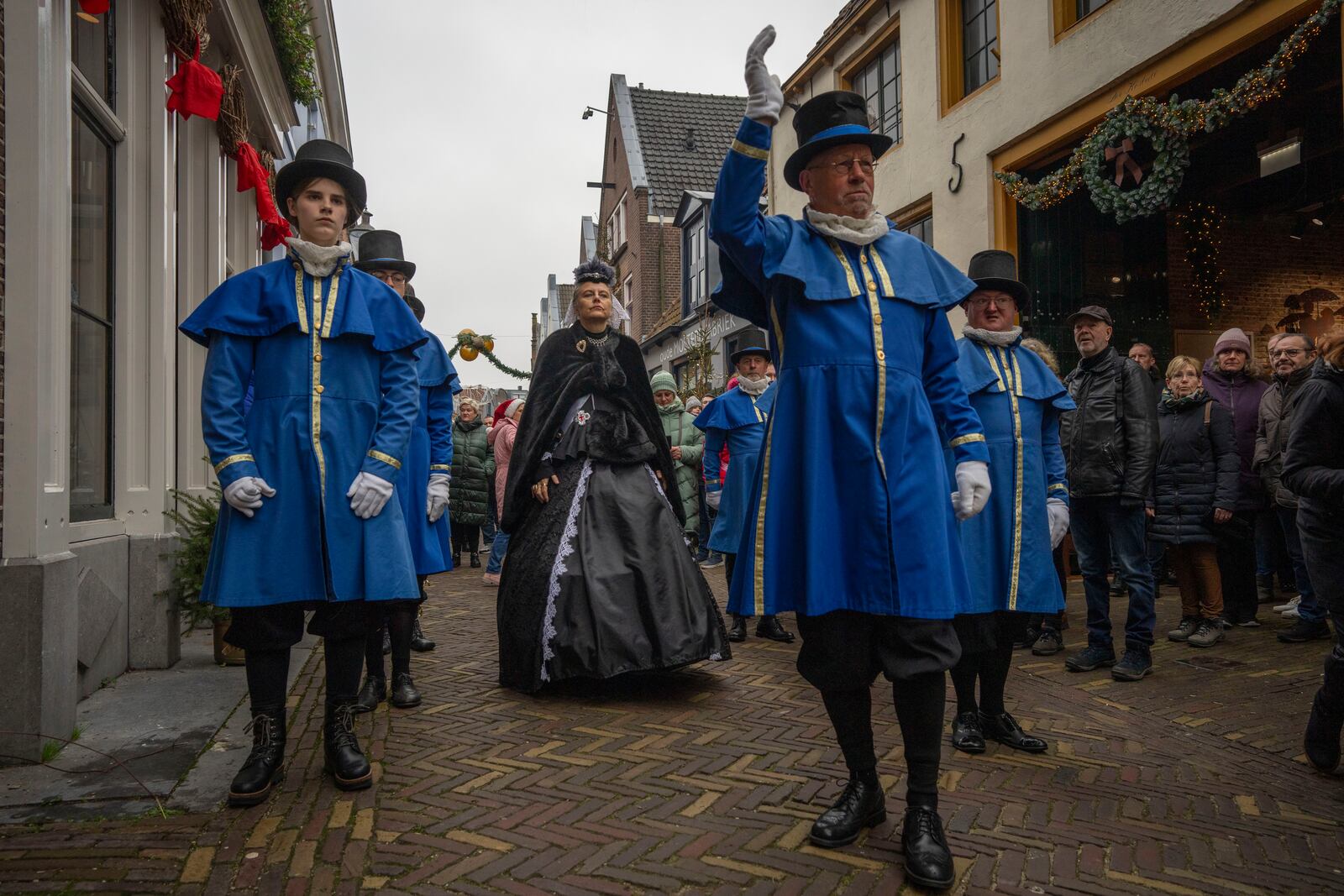 Sandra Nieland plays Queen Victoria a people in costumes from Charles Dickens' 19th-century English era take part in a Dickens Festival, in Deventer, Netherlands, Saturday, Dec. 14, 2024. (AP Photo/Peter Dejong)