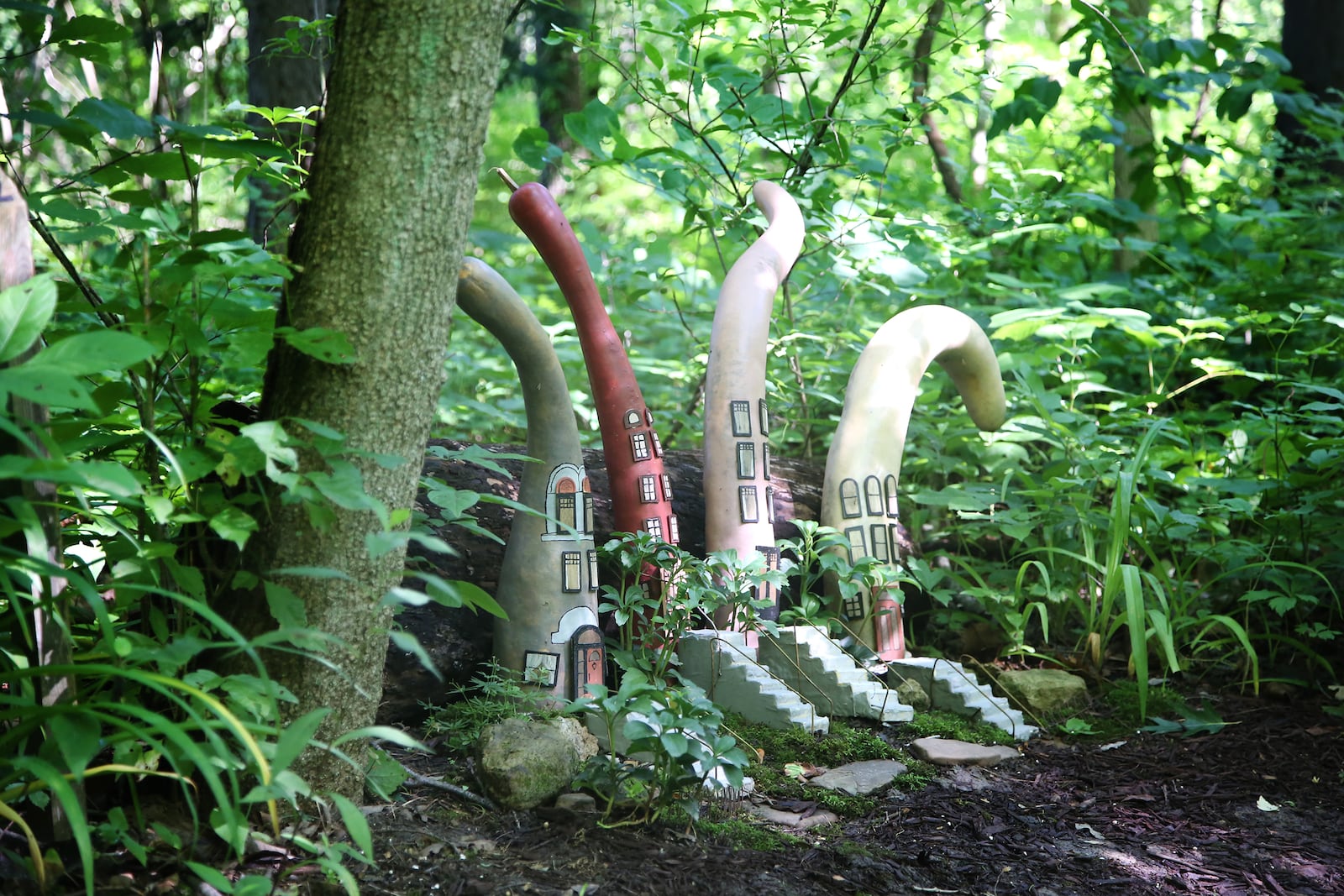 The Faerie Communities of Aullwood are a series of petite structures made from gourds tucked along the Birds, Flight and Wrights Trail.  LISA POWELL / STAFF