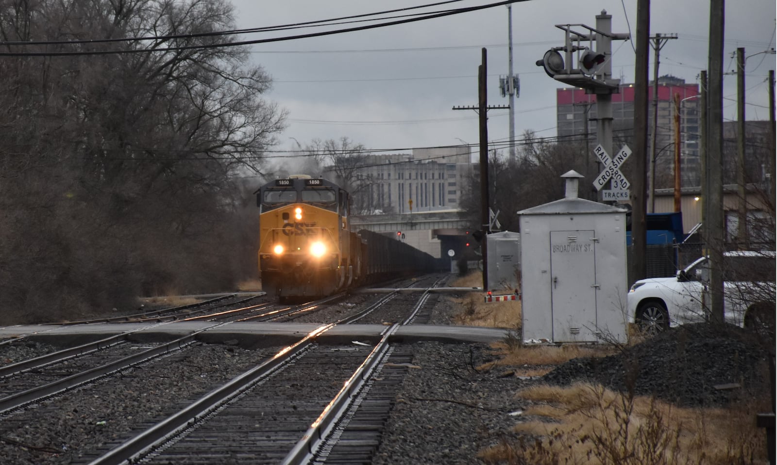 A CSX freight train approaches an at-grade rail crossing on South Broadway Street in Dayton's Edgemont neighborhood in late December 2024. CORNELIUS FROLIK / STAFF