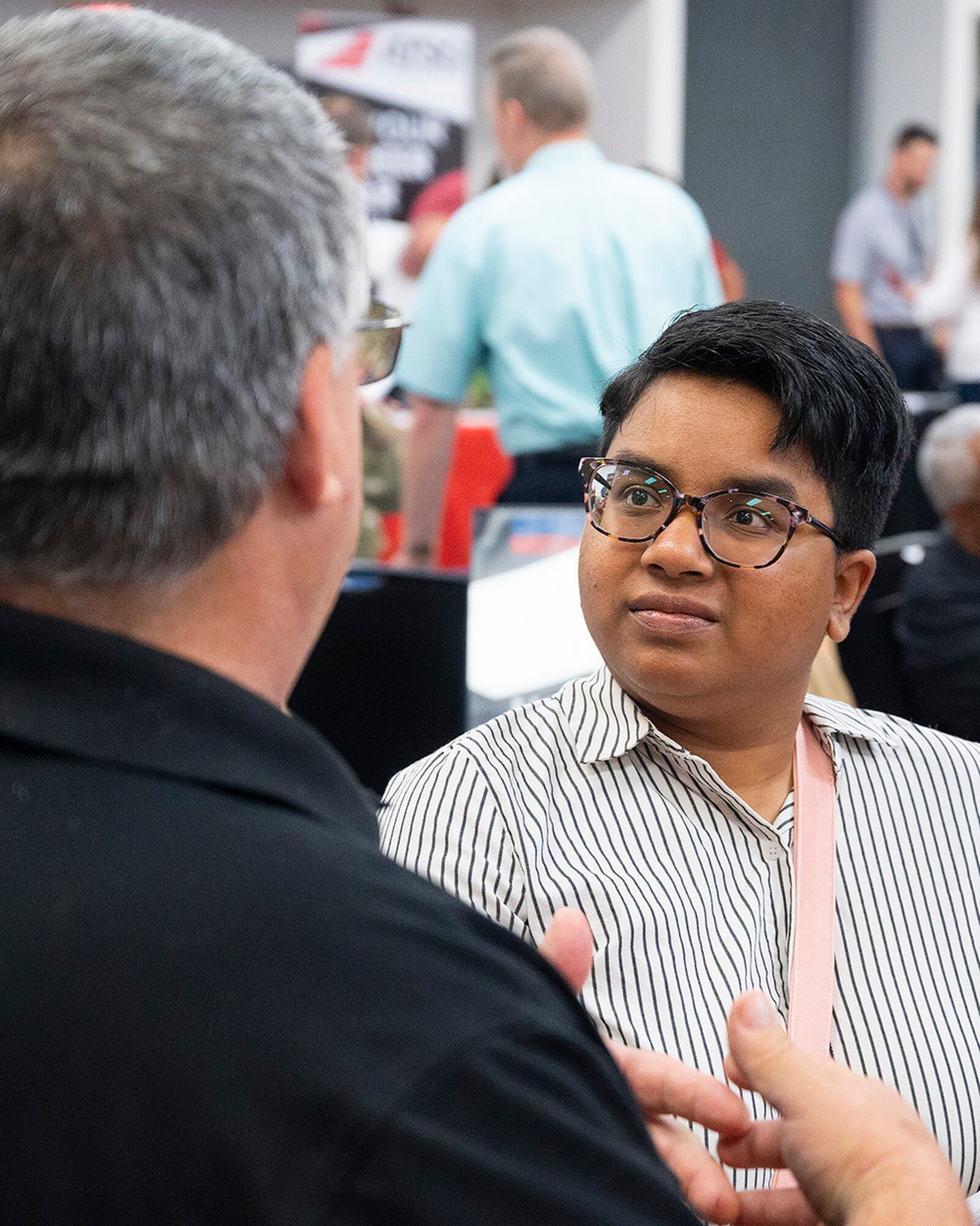 Teresa Burch, a recent military retiree, listens to Patrick Moynihan, a Crown Lift Trucks representative, discuss job opportunities while attending the Hiring Our Heroes event June 22 at Hope Hotel near Wright-Patterson Air Force Base. U.S. AIR FORCE PHOTO/R.J. ORIEZ