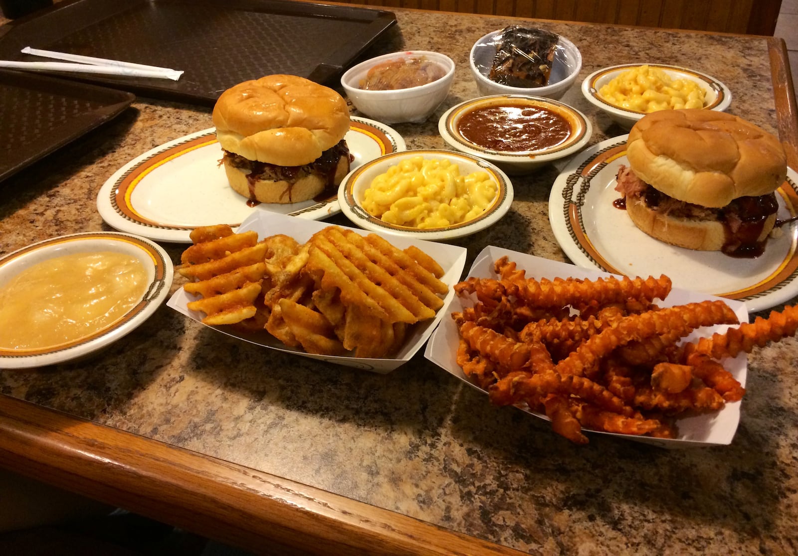 One of Hickory River Smokehouse in Tipp City's Summer Restaurant Week specials. For $20.14, you can get two sandwiches, four sides, two appetizers and two desserts. (MICHELLE FONG/STAFF