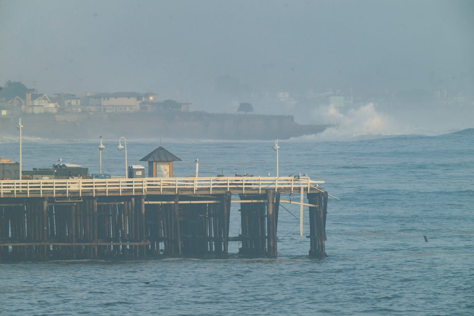 Damage is seen on the end of Santa Cruz Wharf during high surf in Santa Cruz, Calif., Monday, Dec. 23, 2024. (AP Photo/Nic Coury)