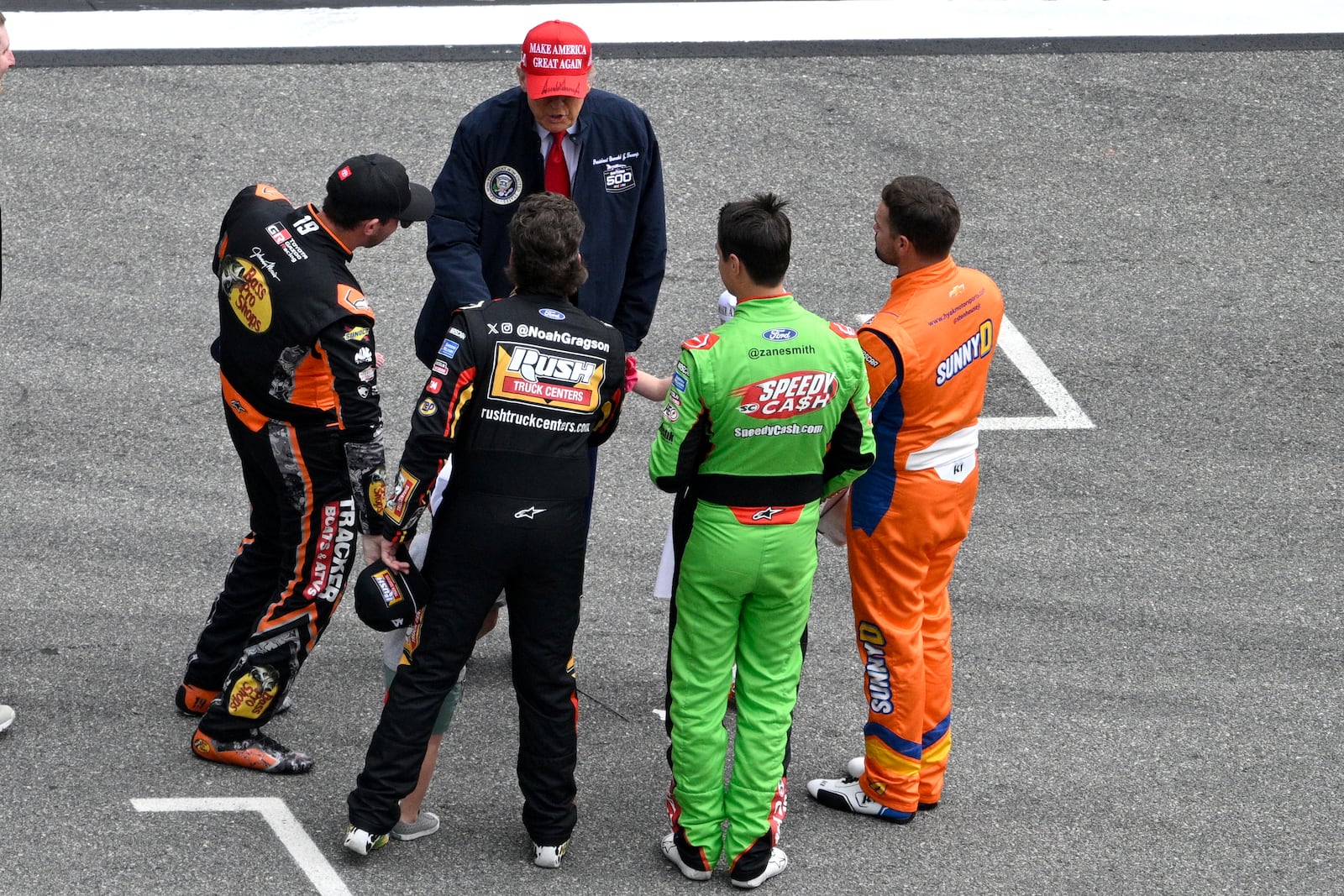 President Donald Trump greets drivers on pit lane before the NASCAR Daytona 500 auto race at Daytona International Speedway, Sunday, Feb. 16, 2025, in Daytona Beach, Fla. (AP Photo/Phelan M. Ebenhack)