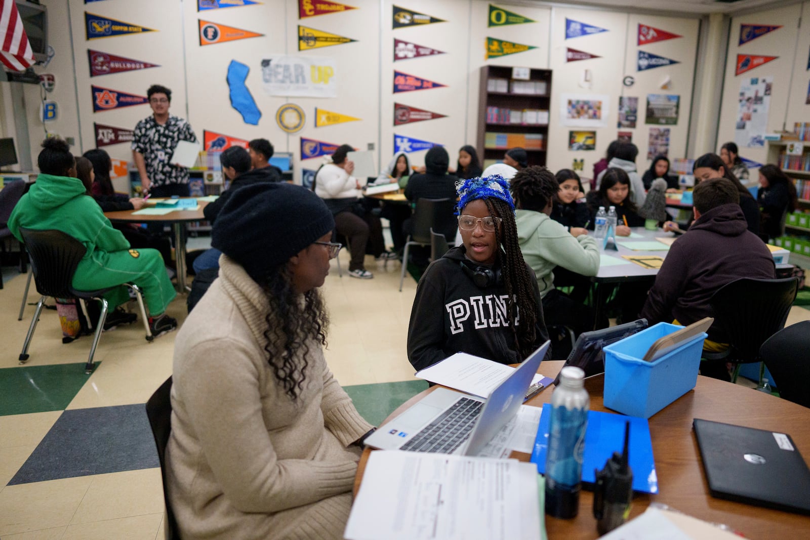 A tutor helps student Harmoni Knight in a classroom at Benjamin O. Davis Middle School in Compton, Calif., Thursday, Feb. 6,, 2025. (AP Photo/Eric Thayer)