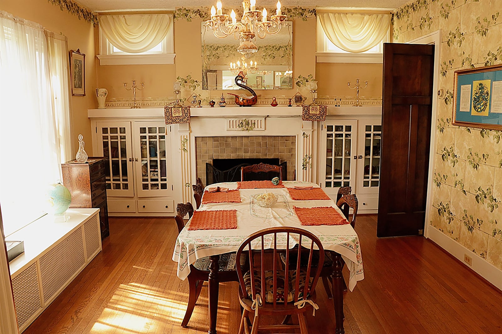 Folding French doors open from the foyer into the formal dining room, which has a fireplace flanked by built-in china cabinets and linen drawers. CONTRIBUTED PHOTO BY KATHY TYLER