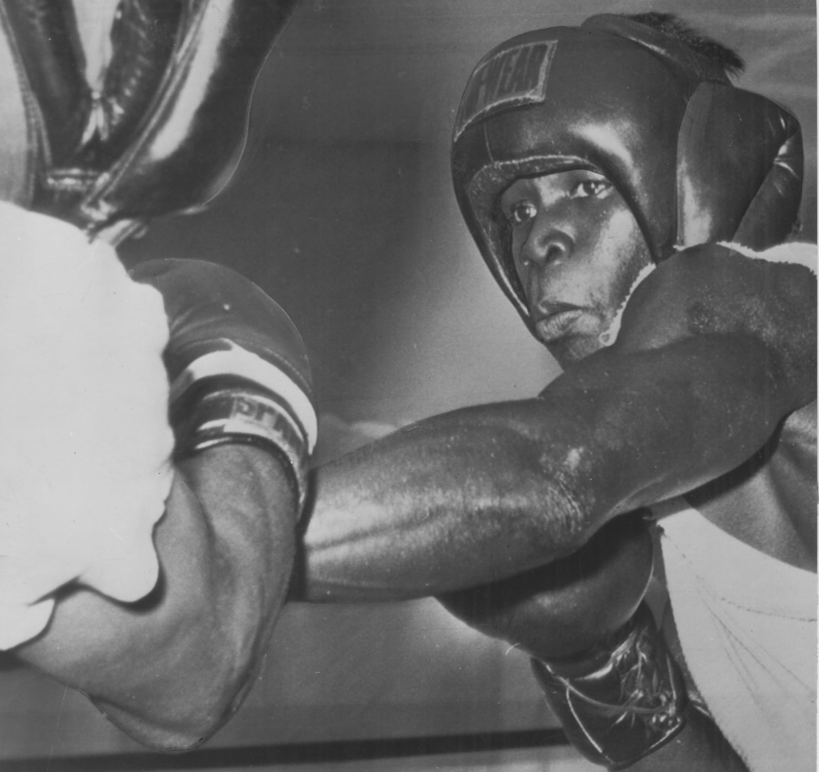 Middleweight champion Emile Griffith sharpens his left with a sparring partner. (Associated Press) 1963