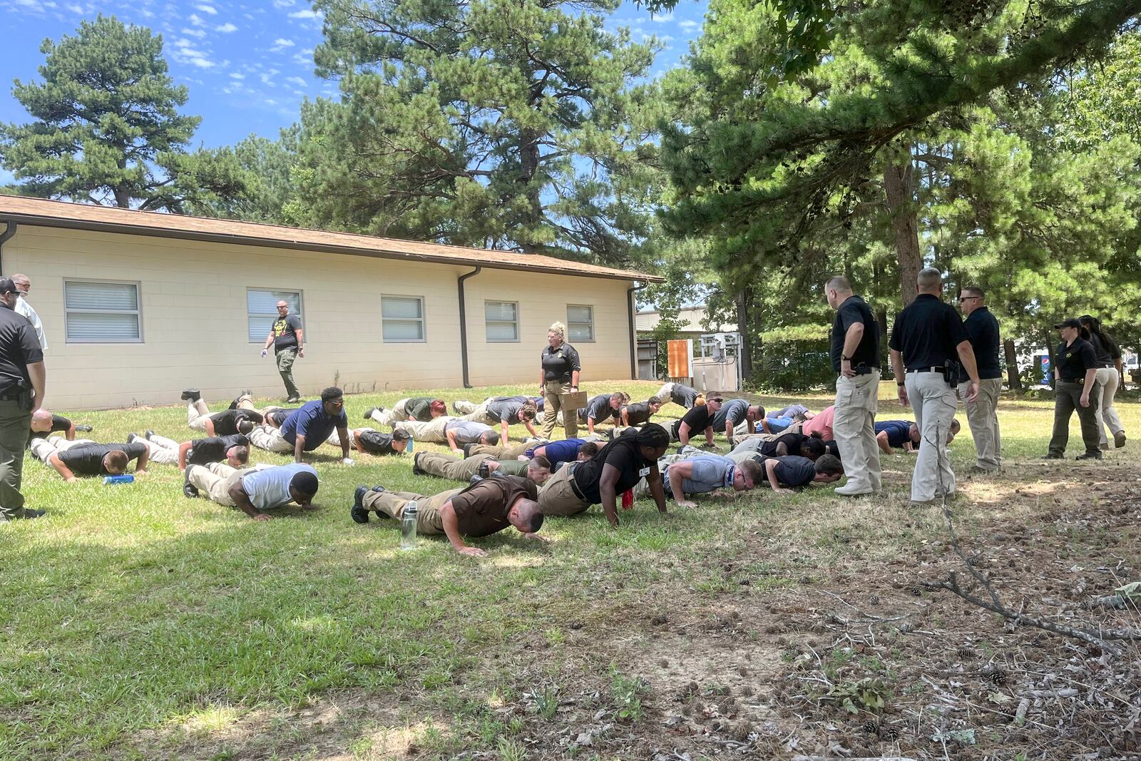 This photo provided by Jackson Law Firm shows Vincent Parks, back left, shortly before collapsing during police training on a hot afternoon in July 2022. (Jackson Law Firm via AP)