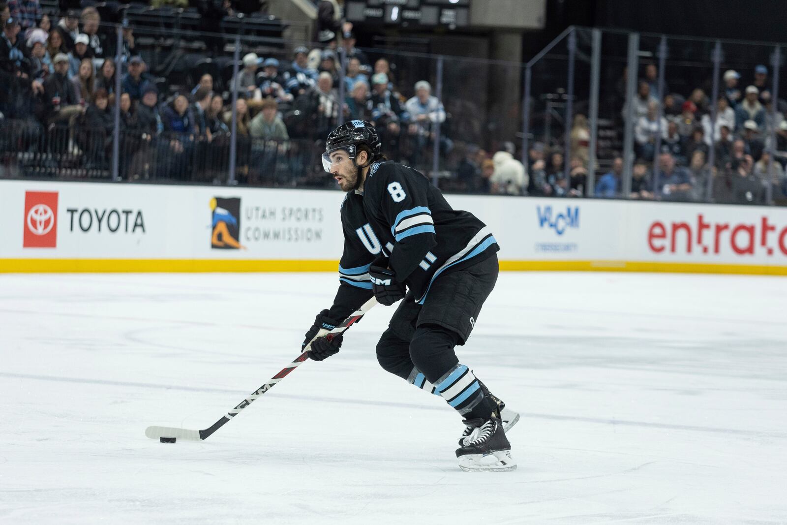 Utah Hockey Club center Nick Schmaltz skates with the puck against the Columbus Blue Jackets during the first period of an NHL hockey game Friday, Jan. 31, 2025, in Salt Lake City. (AP Photo/Melissa Majchrzak)