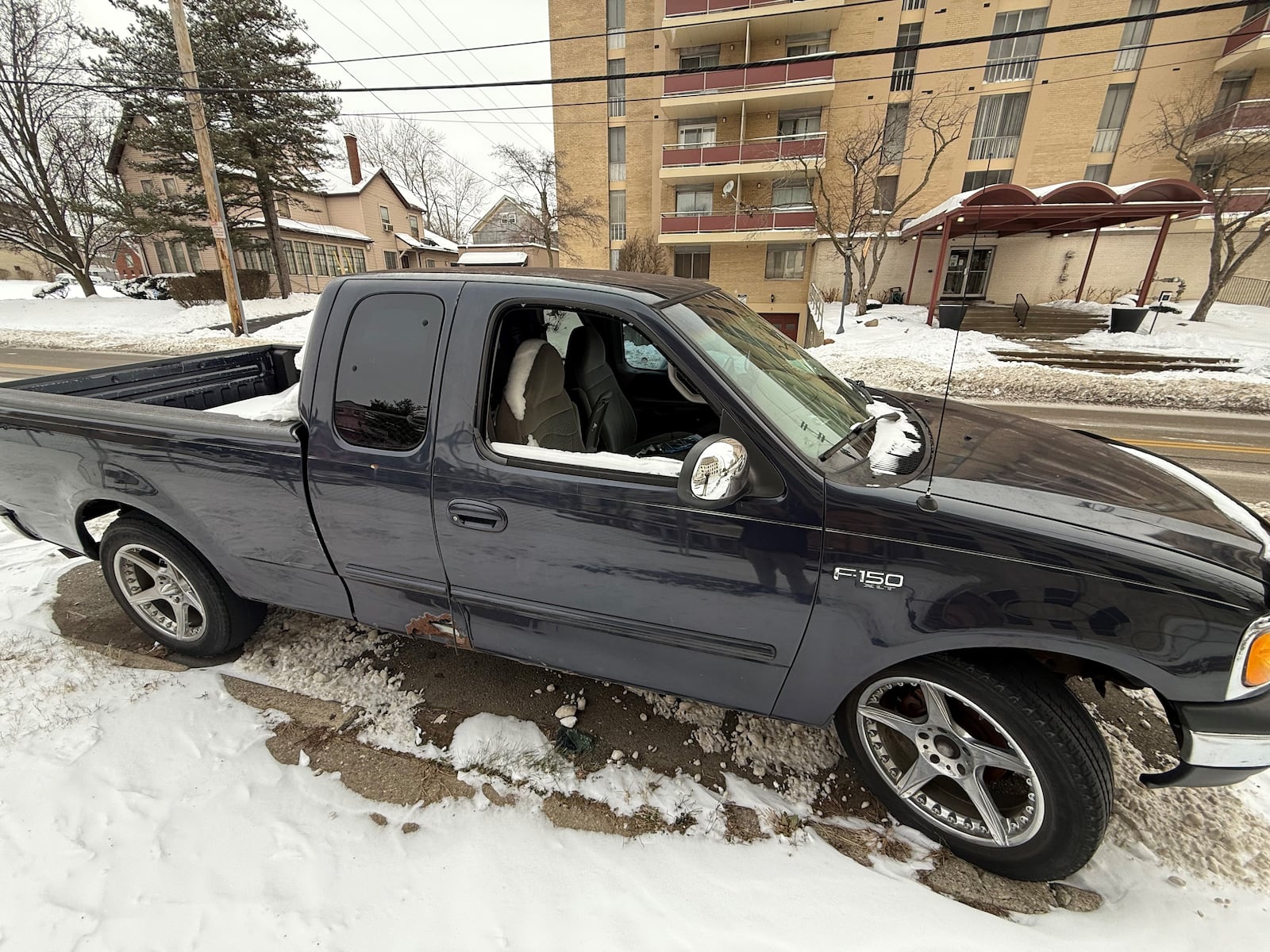 The city received a report of an abandoned vehicle on Grand Avenue in Dayton's Grafton Hill neighborhood. The Ford F-150 truck has a broken out passenger window, and some people say the vehicle has been taking up a prime parking spot for a while. CORNELIUS FROLIK / STAFF