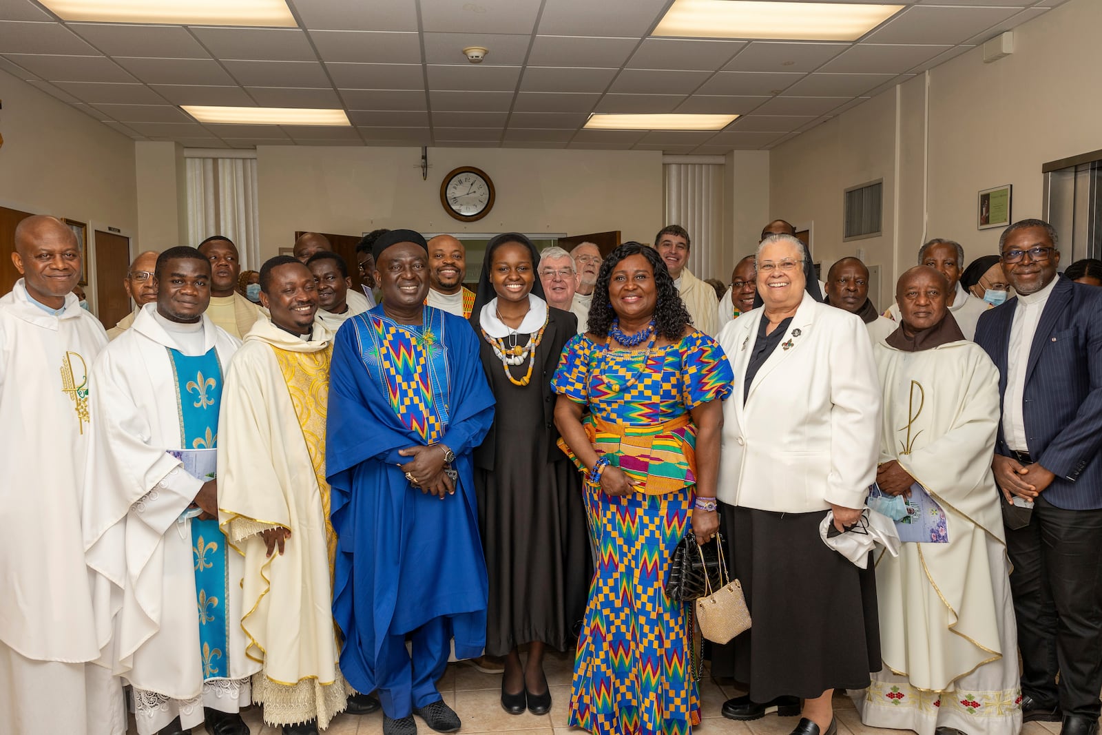 In this photo provided by Edem M. Adzokpa, Sister Seyram Mary Adzokpa, center, is surrounded by her fellow sisters, friends and family after making her first profession at the Sisters of the Holy Family in New Orleans on Thursday, Aug. 15, 2024. (Edem M. Adzokpa via AP)