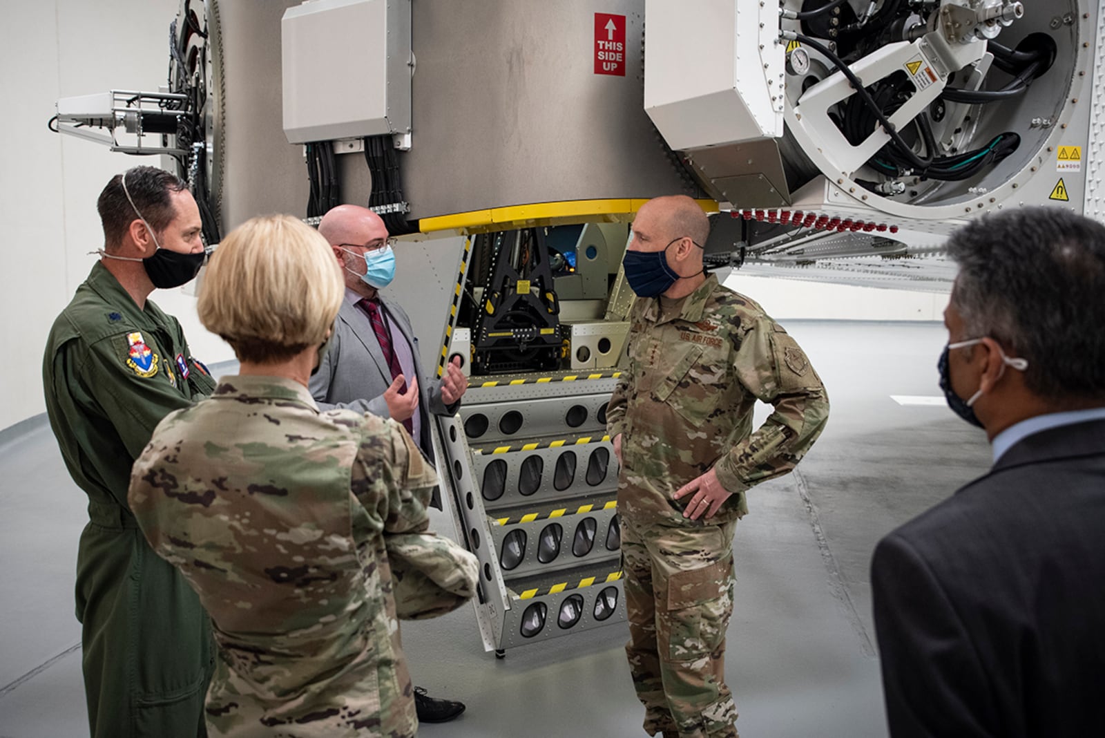 Dr. David Burch, Airman Systems Directorate's Airman Biosciences Division; Lt. Col. Nathan Maertens, Aerospace Physiology Division Chief at the U.S. Air Force School of Aerospace Medicine; Air Force Research Laboratory Commander Brig. Gen. Heather Pringle; and Dr. Rajesh Naik, 711th Human Performance Wing chief scientist, stand in front of the centrifuge and discuss aerospace physiology partnerships with Gen. David Allvin, Air Force vice chief of staff, during Allvin’s visit April 26. U.S. AIR FORCE PHOTO/RICHARD ELDRIDGE