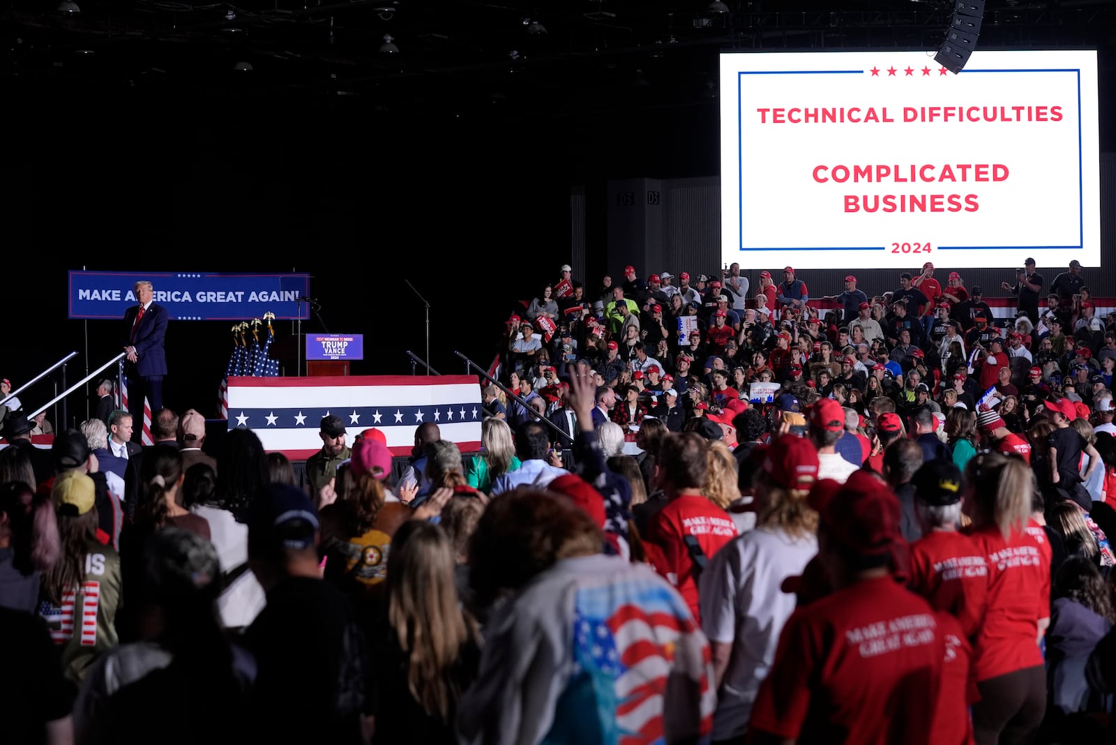 Republican presidential nominee former President Donald Trump pauses during technical difficulties at a campaign rally, Friday, Oct. 18, 2024, in Detroit. (AP Photo/Evan Vucci)