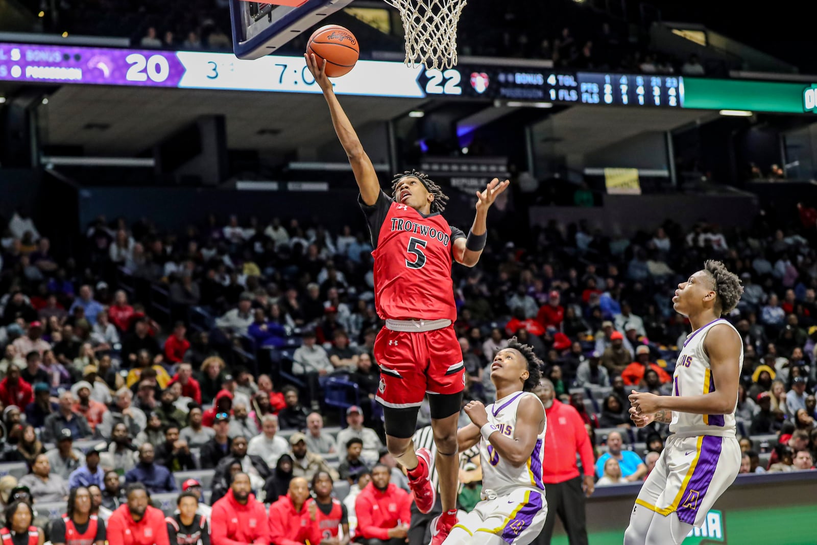 Trotwood Madison High School Baron White drives to the hoop during their Division III regional final game against Cincinnati Aiken on Sunday afternoon at the Xavier University Cintas Center. Aiken won 71-50. Michael Cooper/STAFF