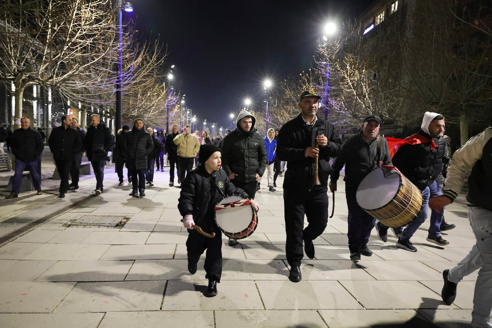 Supporters of left-wing Vetevendosje! party celebrate following results of a parliamentary election, in Pristina, Kosovo, Sunday, Feb. 9, 2025. (AP Photo/Vlasov Sulaj)