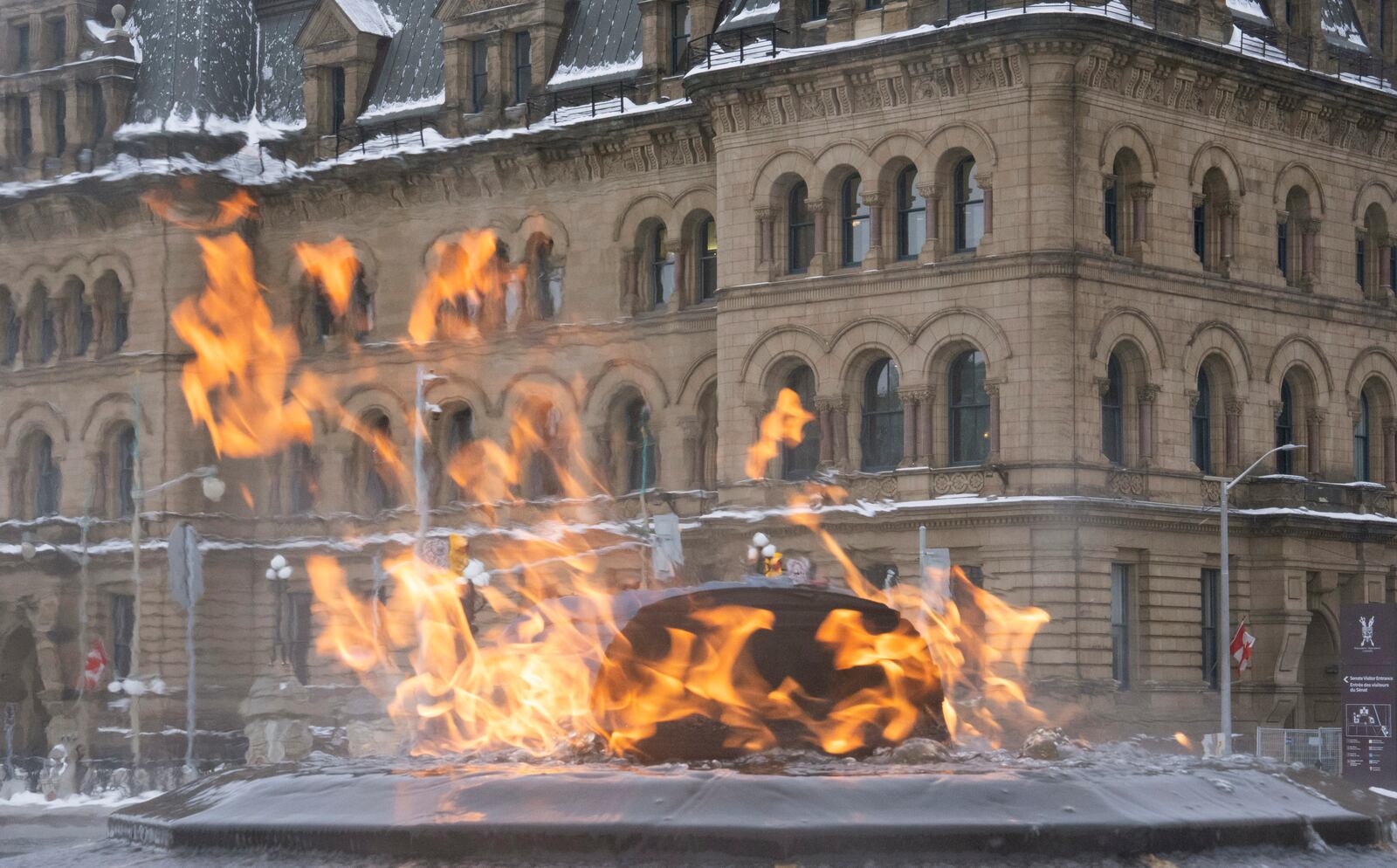 The Centennial flame burns on Parliament Hill near the prime minister's office in the Office of the Prime Minister and Privy Council, Monday, Feb. 3, 2025 in Ottawa. (Adrian Wyld/The Canadian Press via AP)