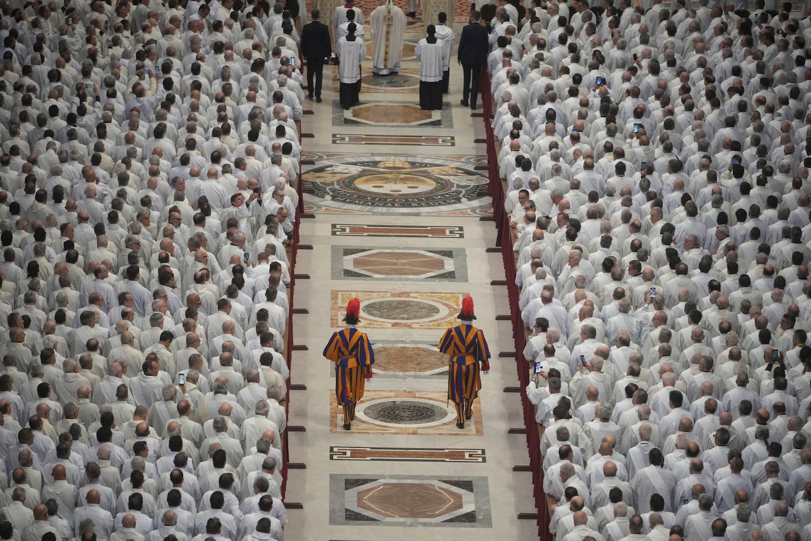 Deacons take part in a mass for their jubilee in St. Peter's Basilica at The Vatican that was supposed to be presided over by Pope Francis who was admitted over a week ago at Rome's Agostino Gemelli Polyclinic and is in critical conditions. (AP Photo/Alessandra Tarantino)