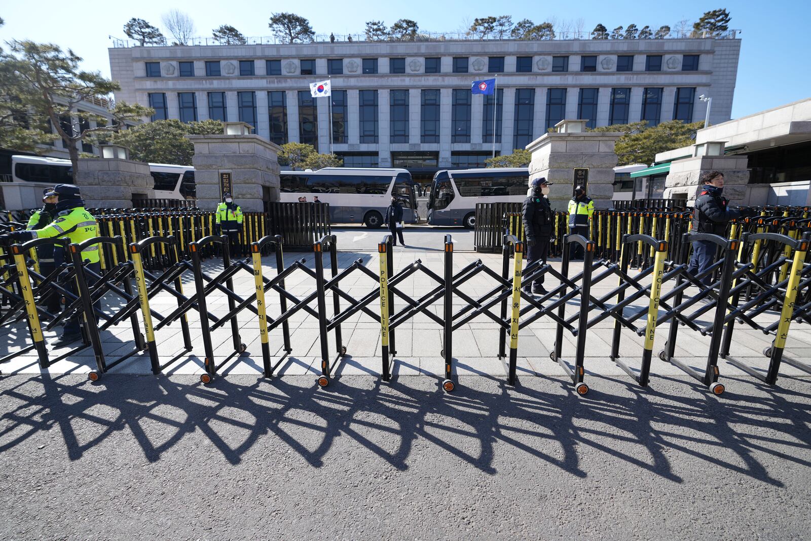 FILE - South Korean police officers stand guard in front of the Constitutional Court in Seoul, South Korea, on Feb. 18, 2025. (AP Photo/Lee Jin-man, File)