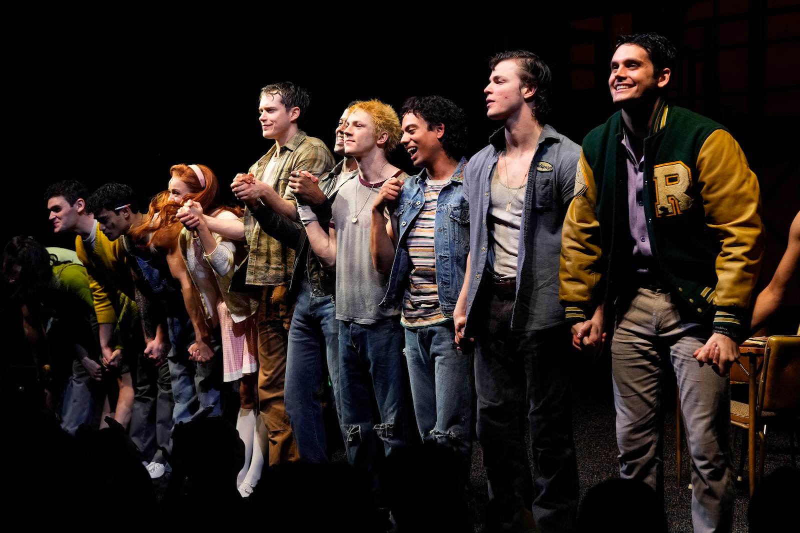 The cast of "The Outsiders" appears at the curtain call following the opening night performance at the Bernard B. Jacobs Theatre on Thursday, April 11, 2024, in New York. (Photo by Charles Sykes/Invision/AP)