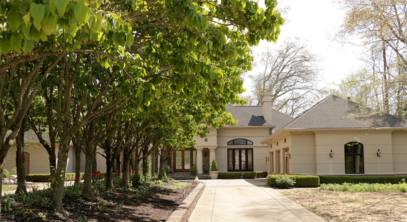 A tree-lined circular driveway leads up to the side-entry, 3-car garage. CONTRIBUTED PHOTOS BY KATHY TYLER