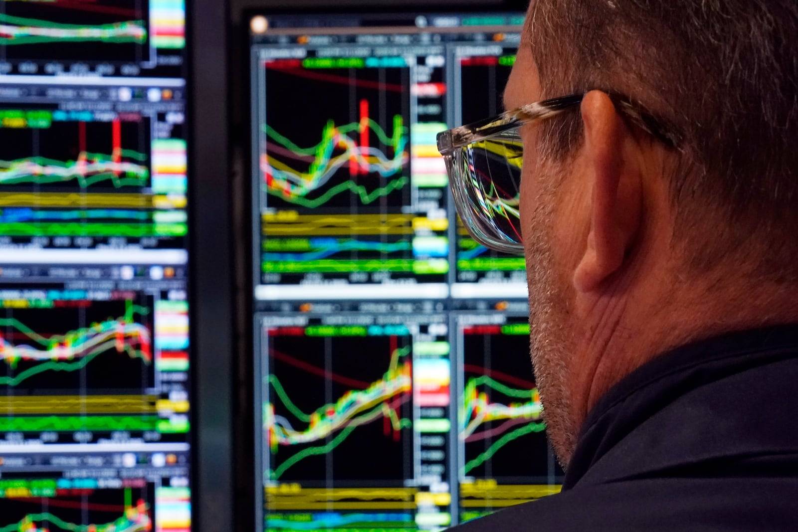 A specialist works at his post on the floor of the New York Stock Exchange, Wednesday, March 12, 2025. (AP Photo/Richard Drew)