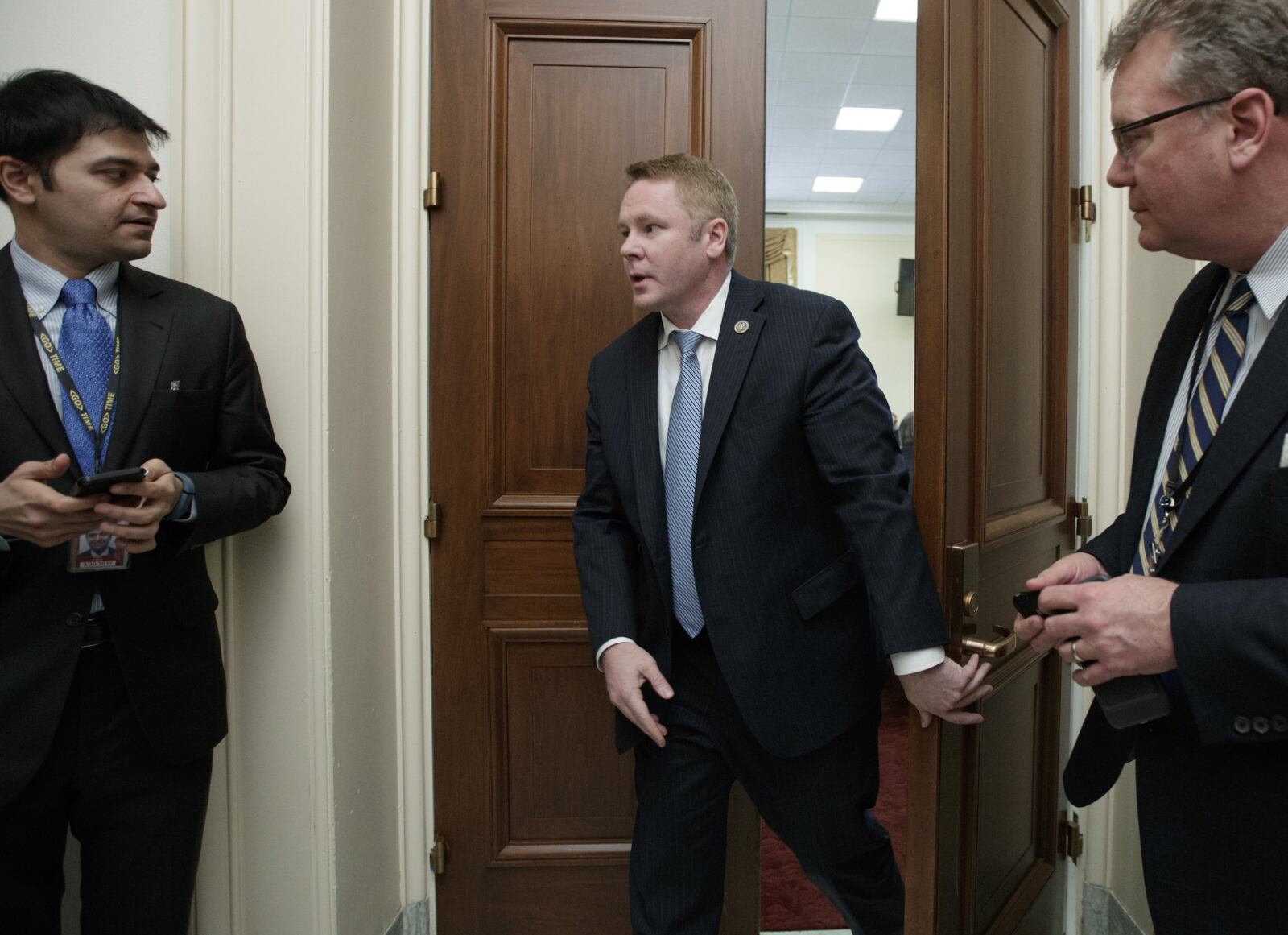 Rep. Warren Davidson, R-Ohio, a member of the Freedom Caucus, leaves a meeting with the conservative coalition on Capitol Hill in Washington, Thursday, March 23, 2017, after their trip to the White House. (AP Photo/J. Scott Applewhite)