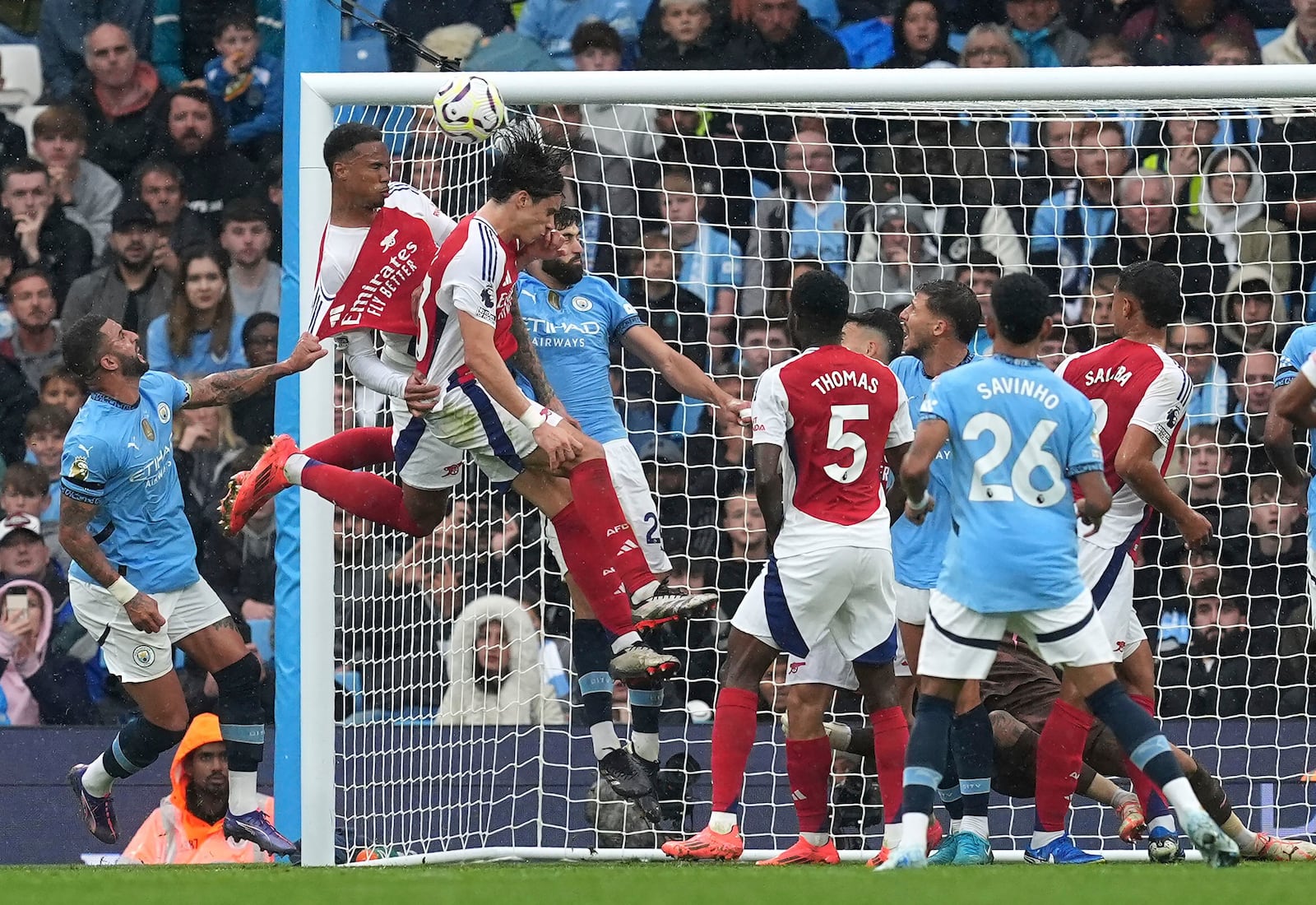 Arsenal's Gabriel scores his side's second goal of the game, during the English Premier League soccer match between Manchester City and Arsenal at the Etihad stadium in Manchester, England, Sunday, Sept. 22, 2024. (Martin Rickett/PA via AP)