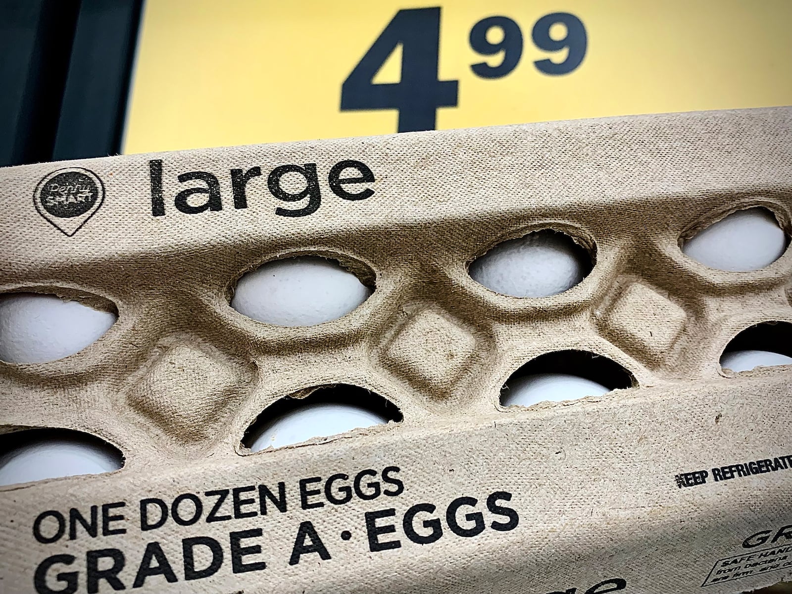 The price is $4.99 for one dozen Grade A large eggs, Tuesday, Feb. 18, 2025 at Meijer. MARSHALL GORBY\STAFF