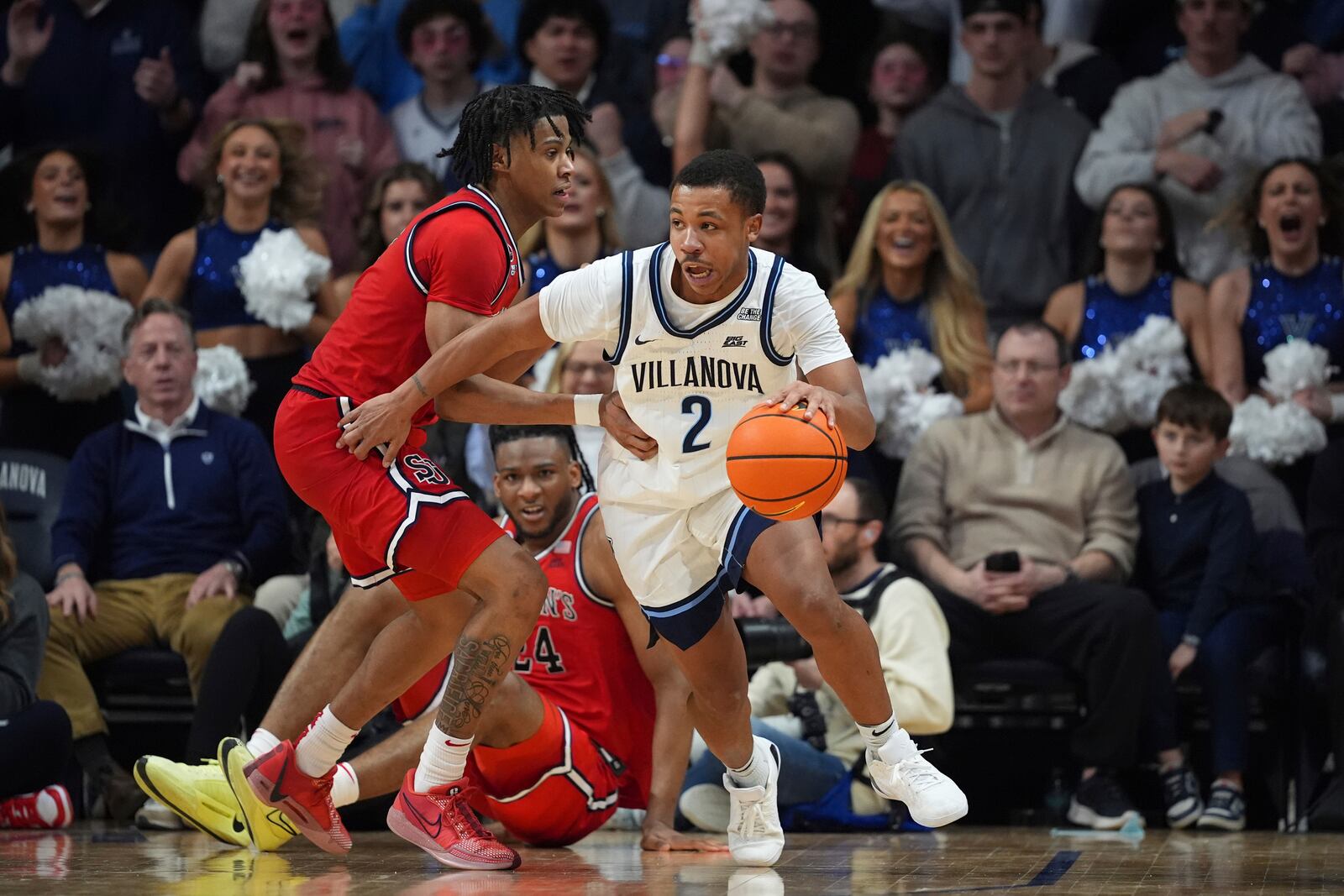 Villanova's Jhamir Brickus, right, tries to get past St. John's Simeon Wilcher during the second half of an NCAA college basketball game, Wednesday, Feb. 12, 2025, in Villanova, Pa. (AP Photo/Matt Slocum)