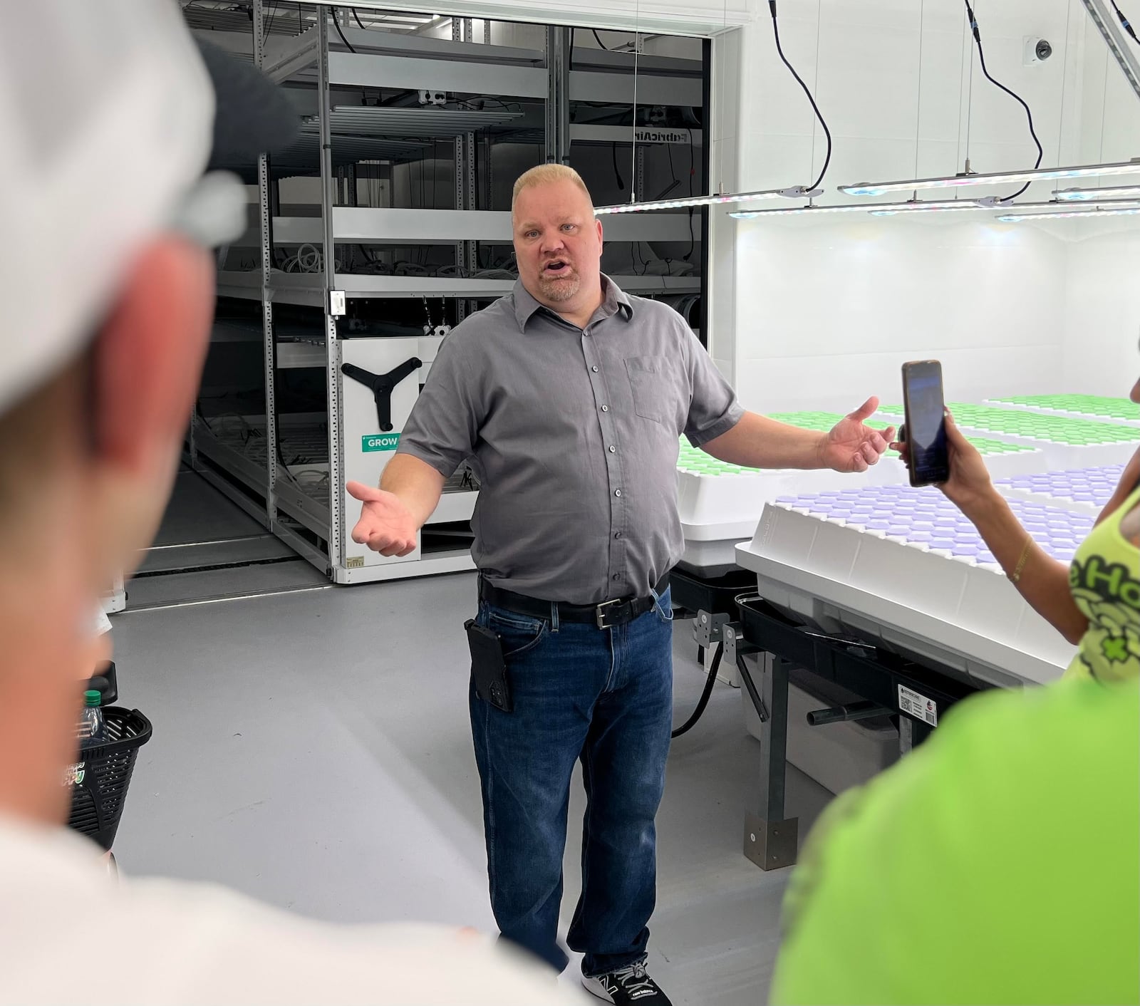 Jason Wilson, owner of Paragon Development Group, speaks with visitors Friday during a public tour of his new medical marijuana growing facility, located at 9292 State Route 201 in Tipp City. AIMEE HANCOCK/STAFF