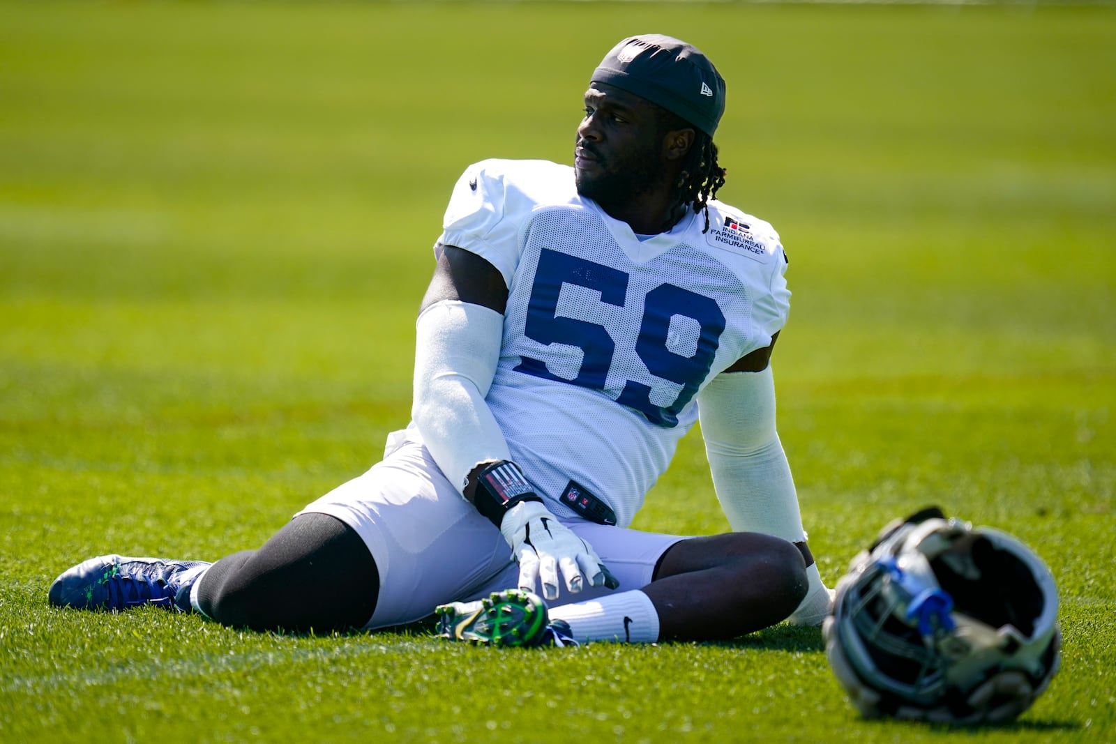 Indianapolis Colts defensive end Ifeadi Odenigbo (59) stretches during practice at the NFL team's football training camp in Westfield, Ind., Wednesday, Aug. 24, 2022. (AP Photo/Michael Conroy)