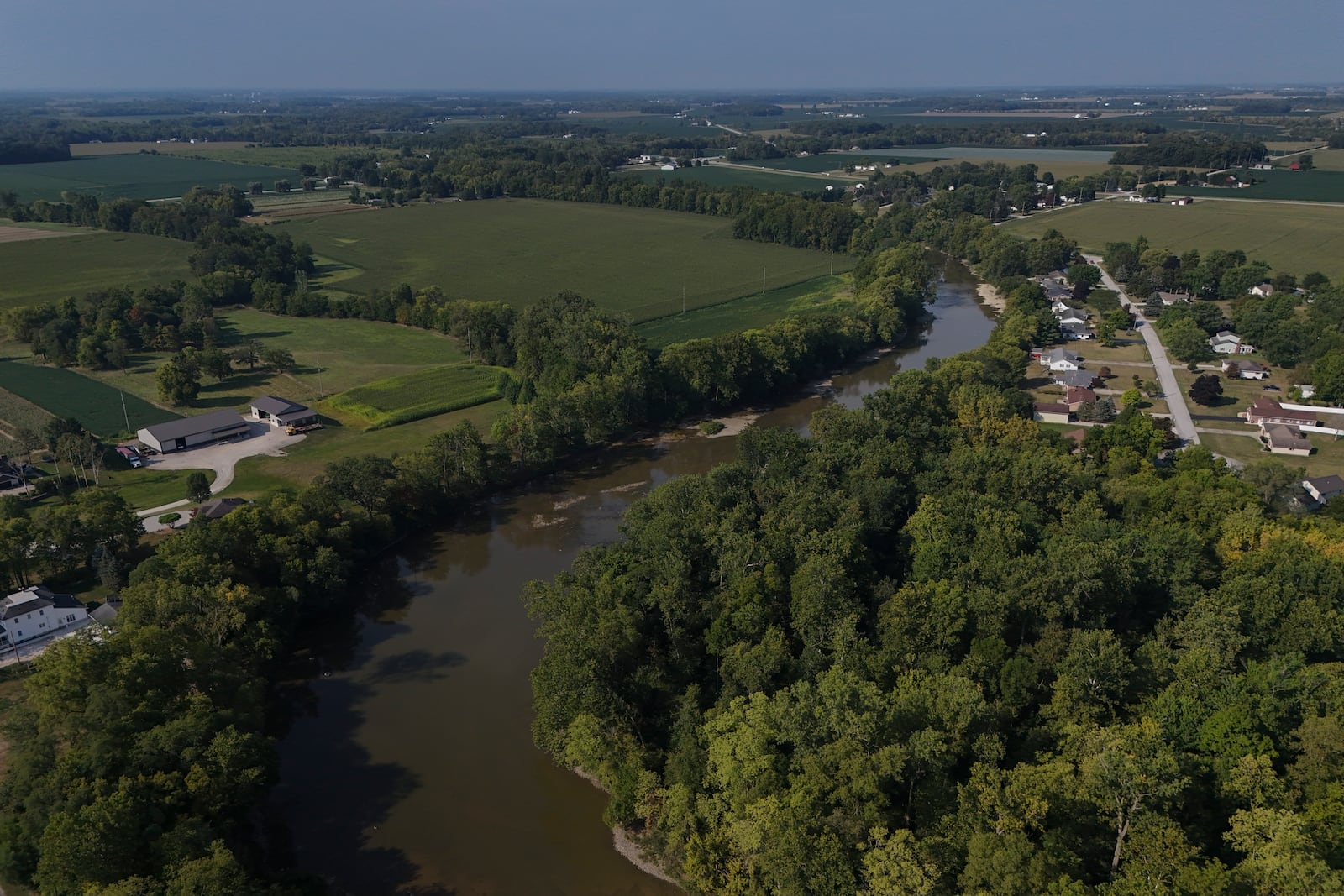 Water flows down the Sandusky River, Monday, Aug. 26, 2024, in Fremont, Ohio. (AP Photo/Joshua A. Bickel)